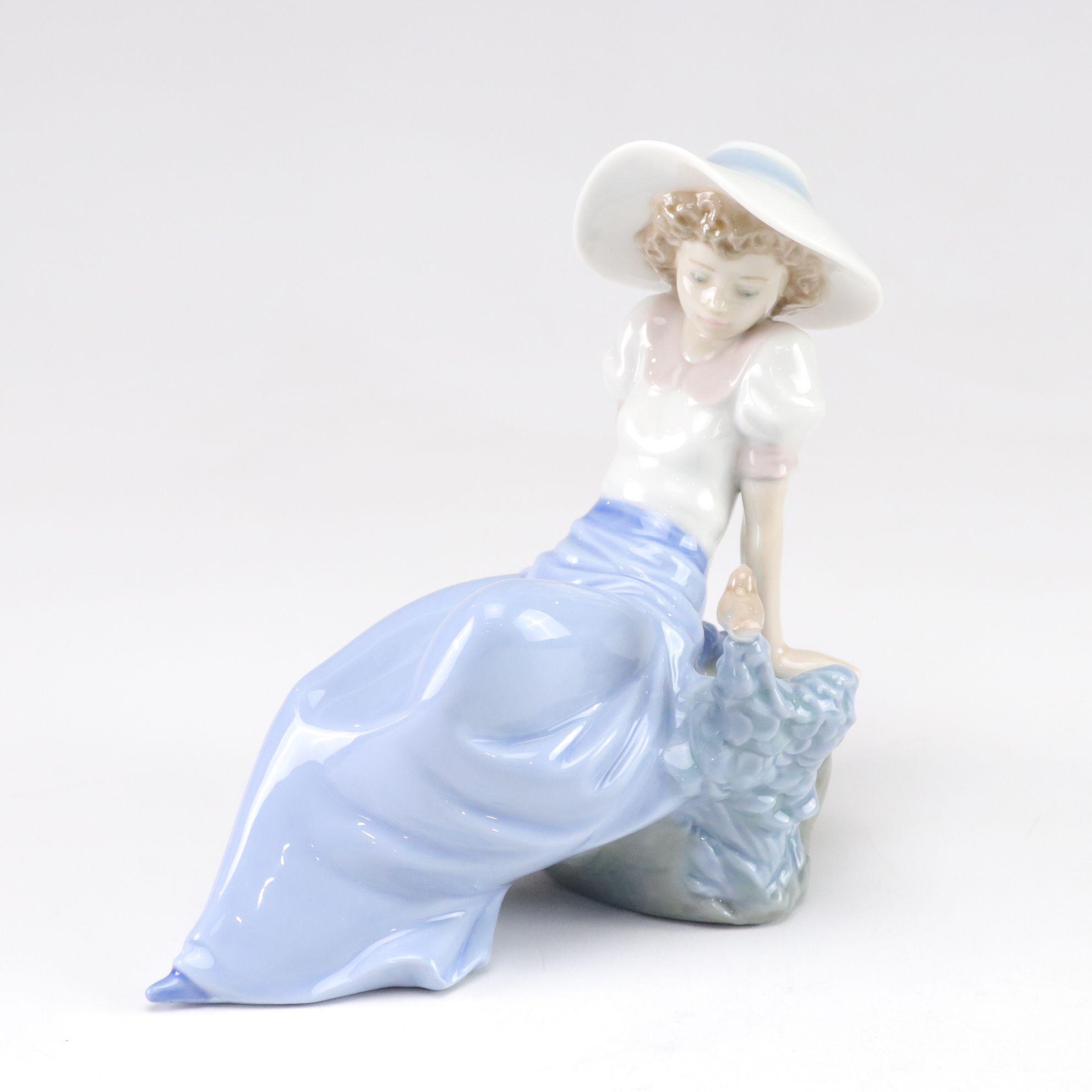 Lladró "My Best Friend" and Nao "Listening to the Birds" Porcelain Figurines