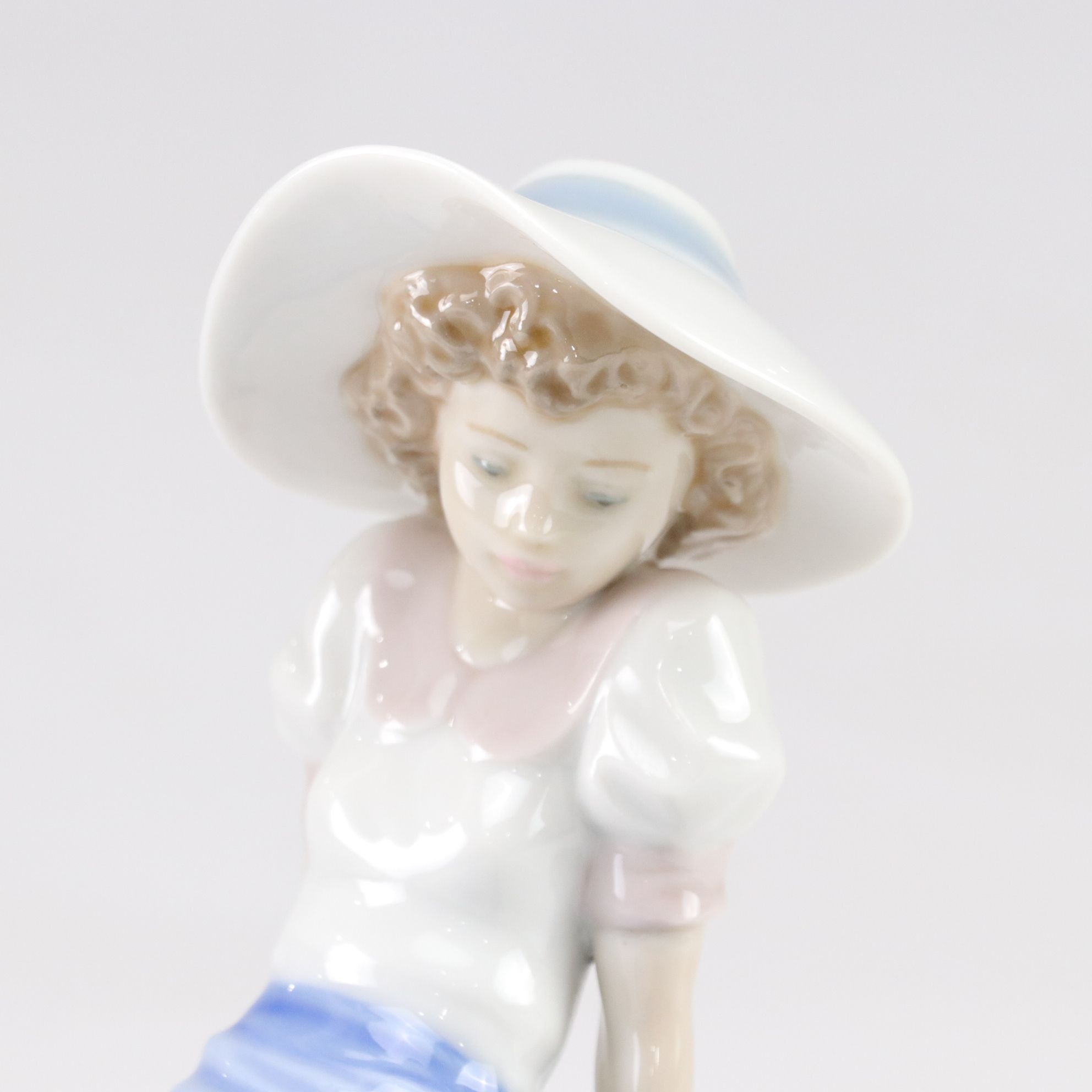 Lladró "My Best Friend" and Nao "Listening to the Birds" Porcelain Figurines