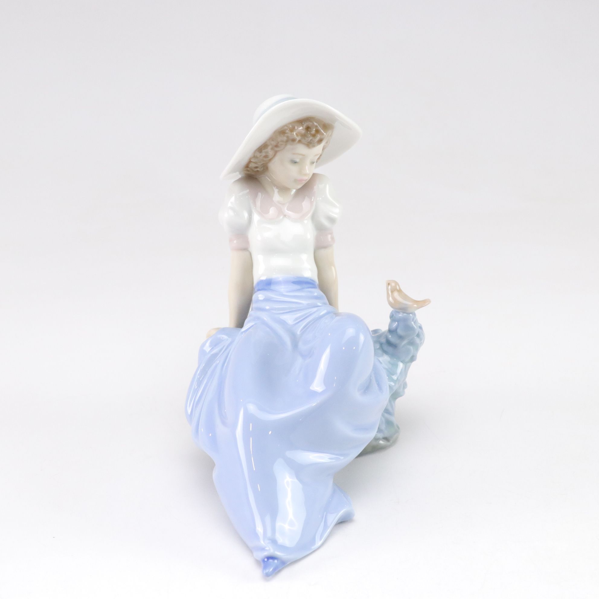 Lladró "My Best Friend" and Nao "Listening to the Birds" Porcelain Figurines