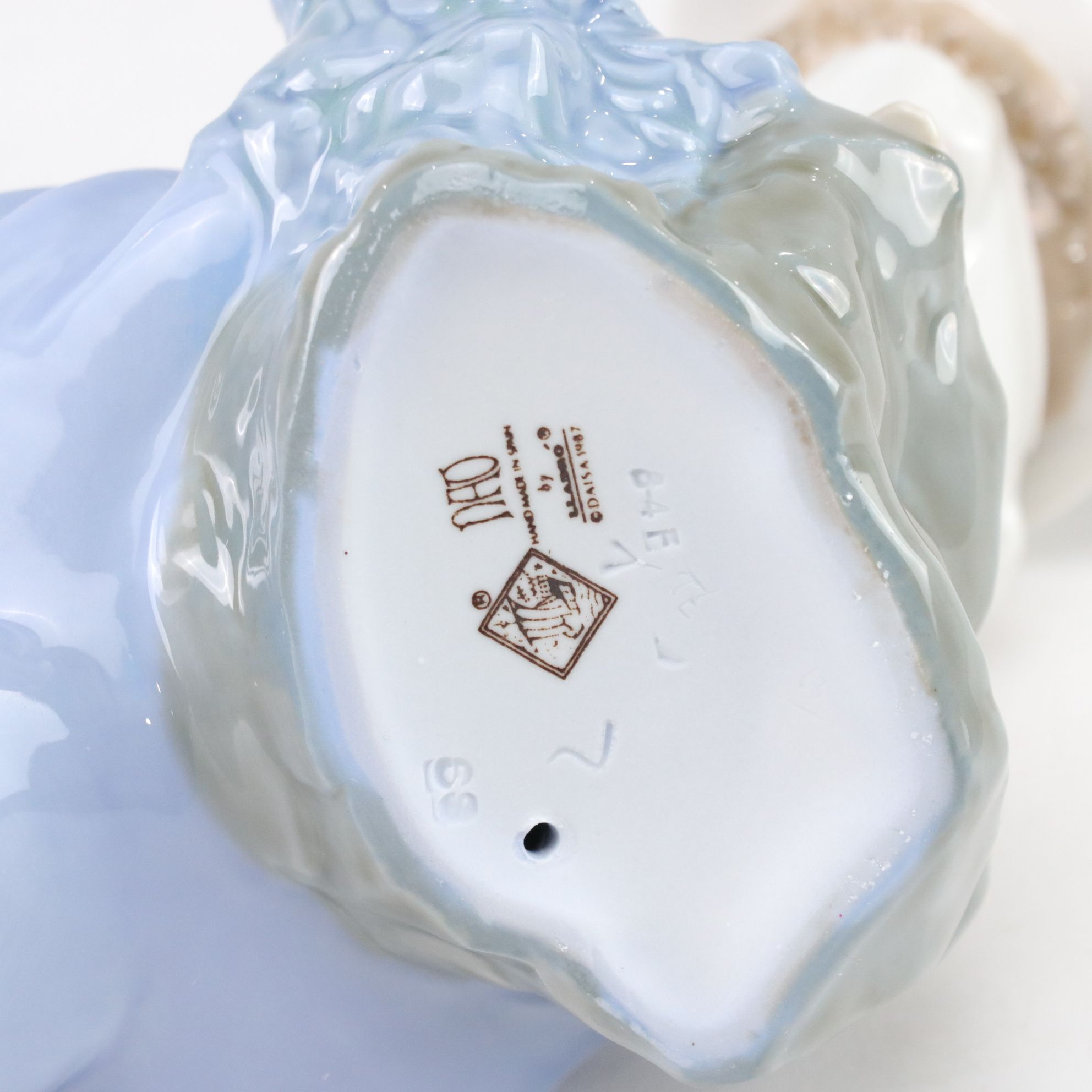 Lladró "My Best Friend" and Nao "Listening to the Birds" Porcelain Figurines