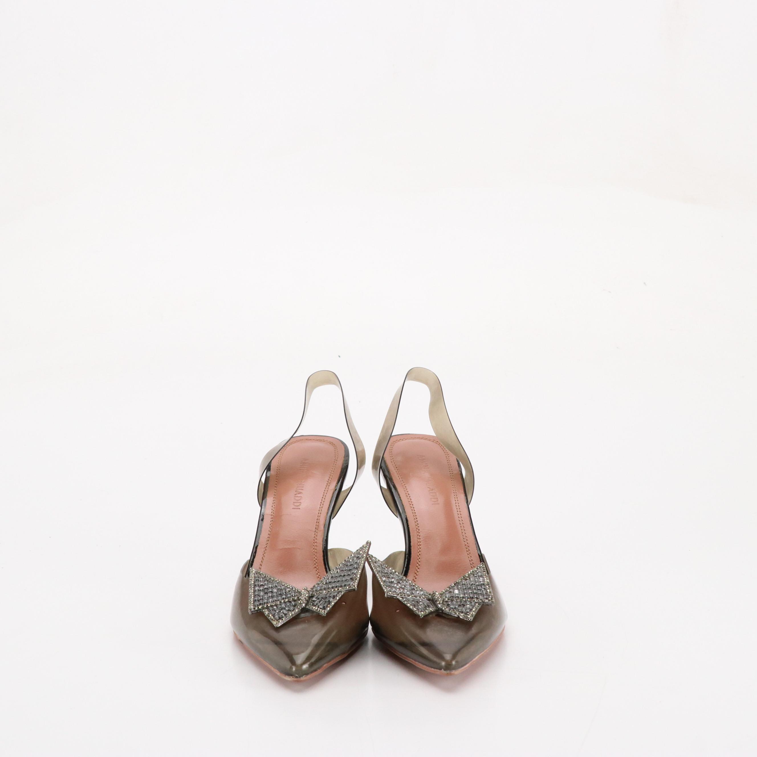 Amina Muaddi Transparent PVC Slingback Pumps with Crystal Embellished Bow