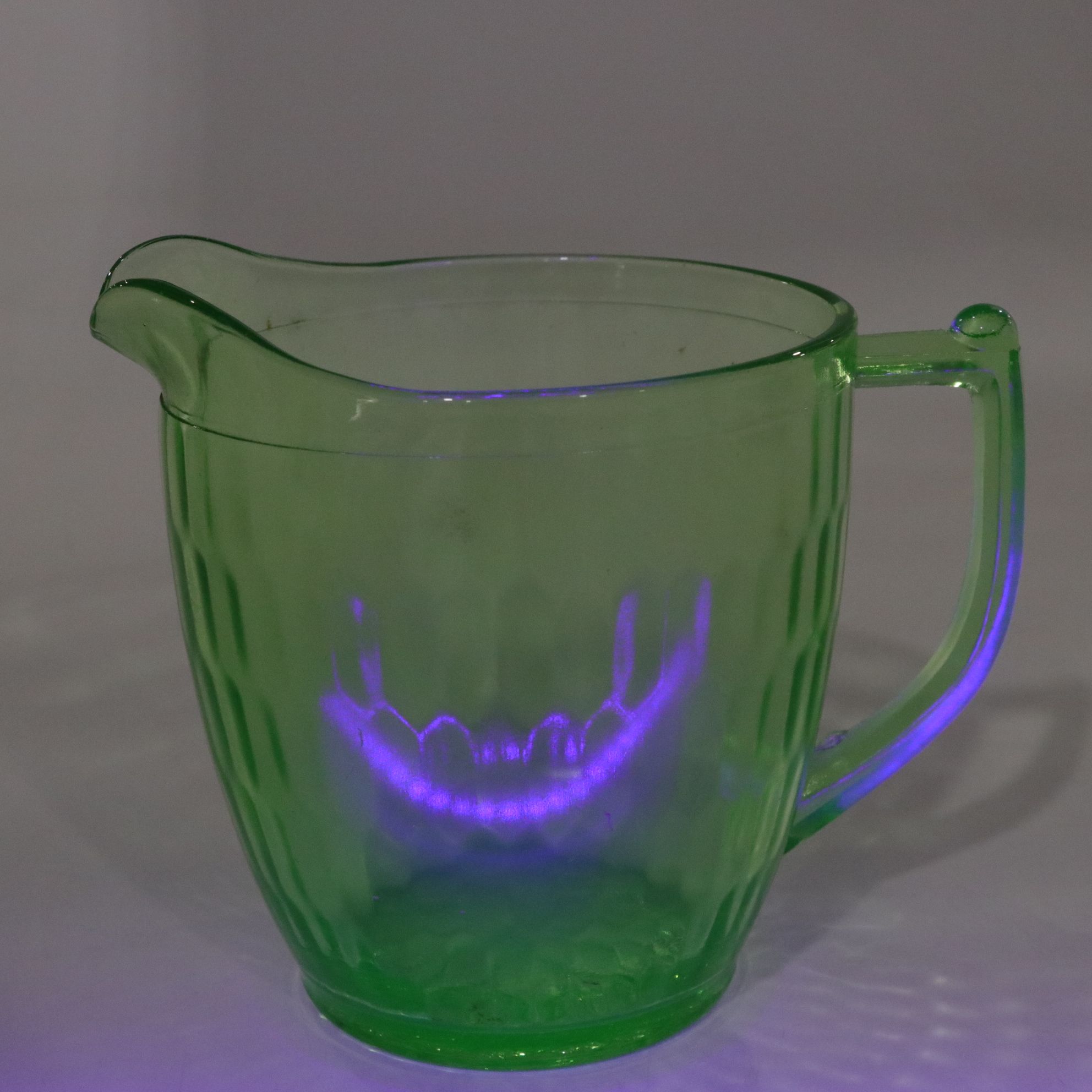 Uranium Glass Pitcher with Pfaltzgraff "Valencia" Bottles and Green Carafe