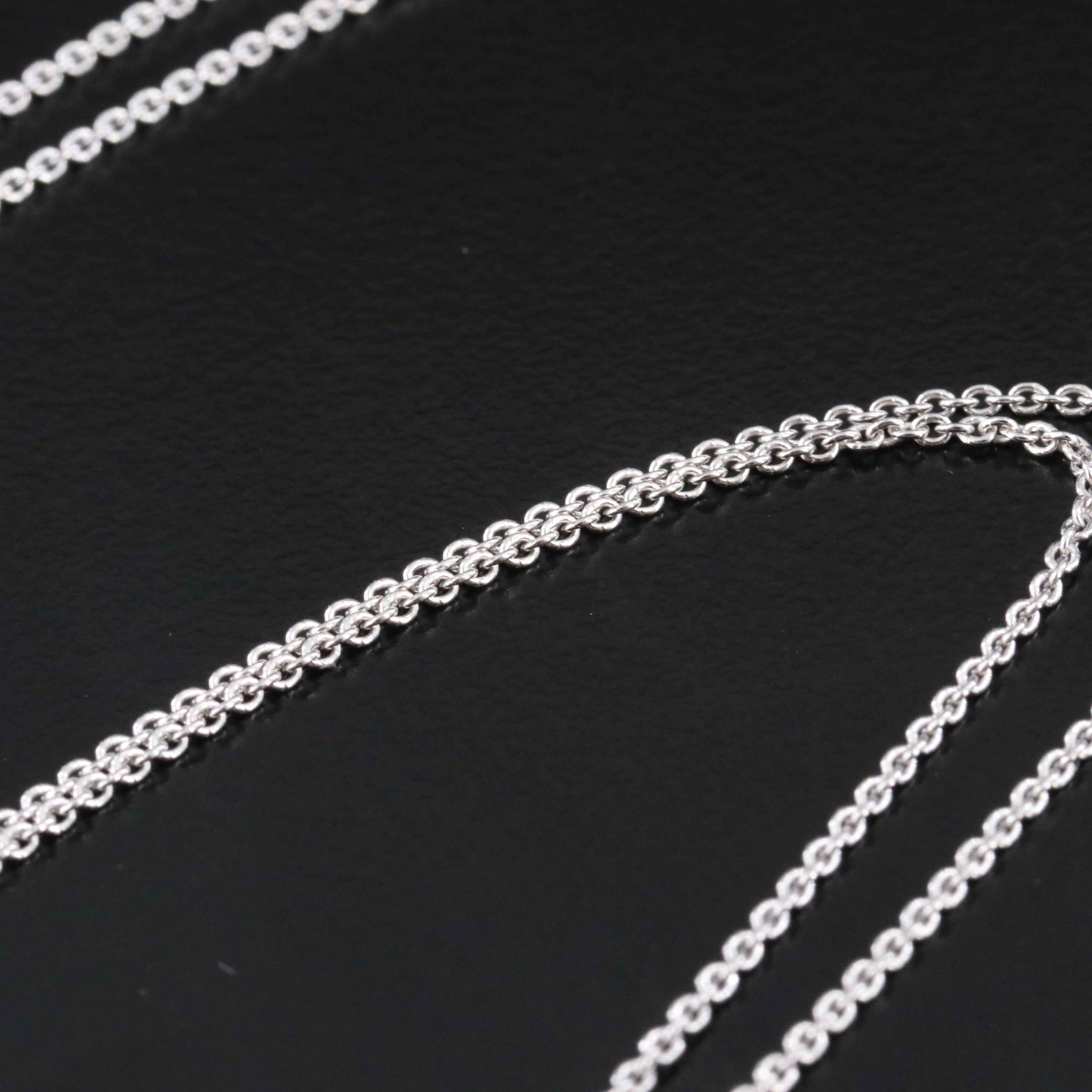 Sterling Diamond Knot Pendant Necklace with Fancy Black Diamond Accents