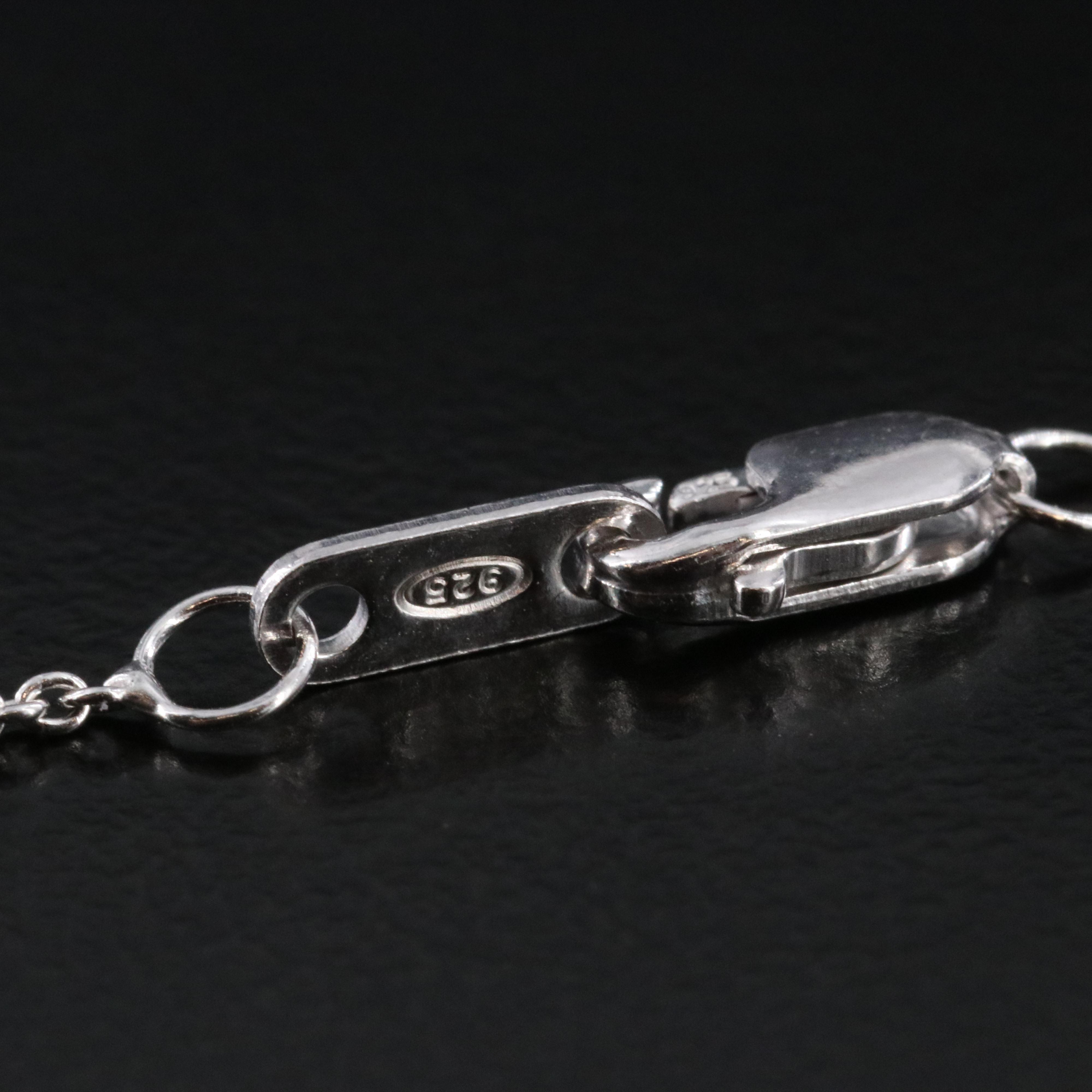 Sterling Diamond Knot Pendant Necklace with Fancy Black Diamond Accents