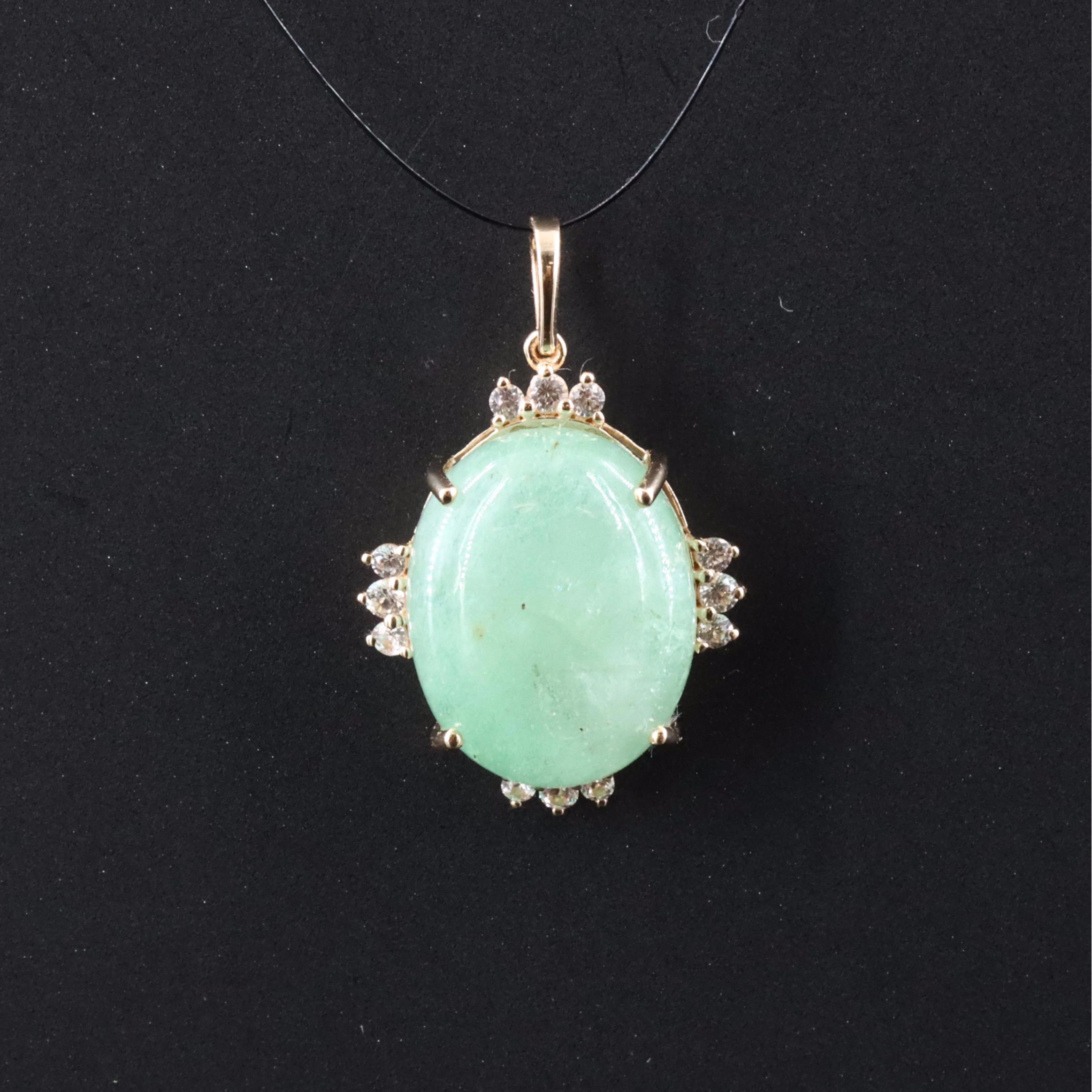 14K 10.96 CT Emerald Pendant with White Sapphire and White Topaz Accents