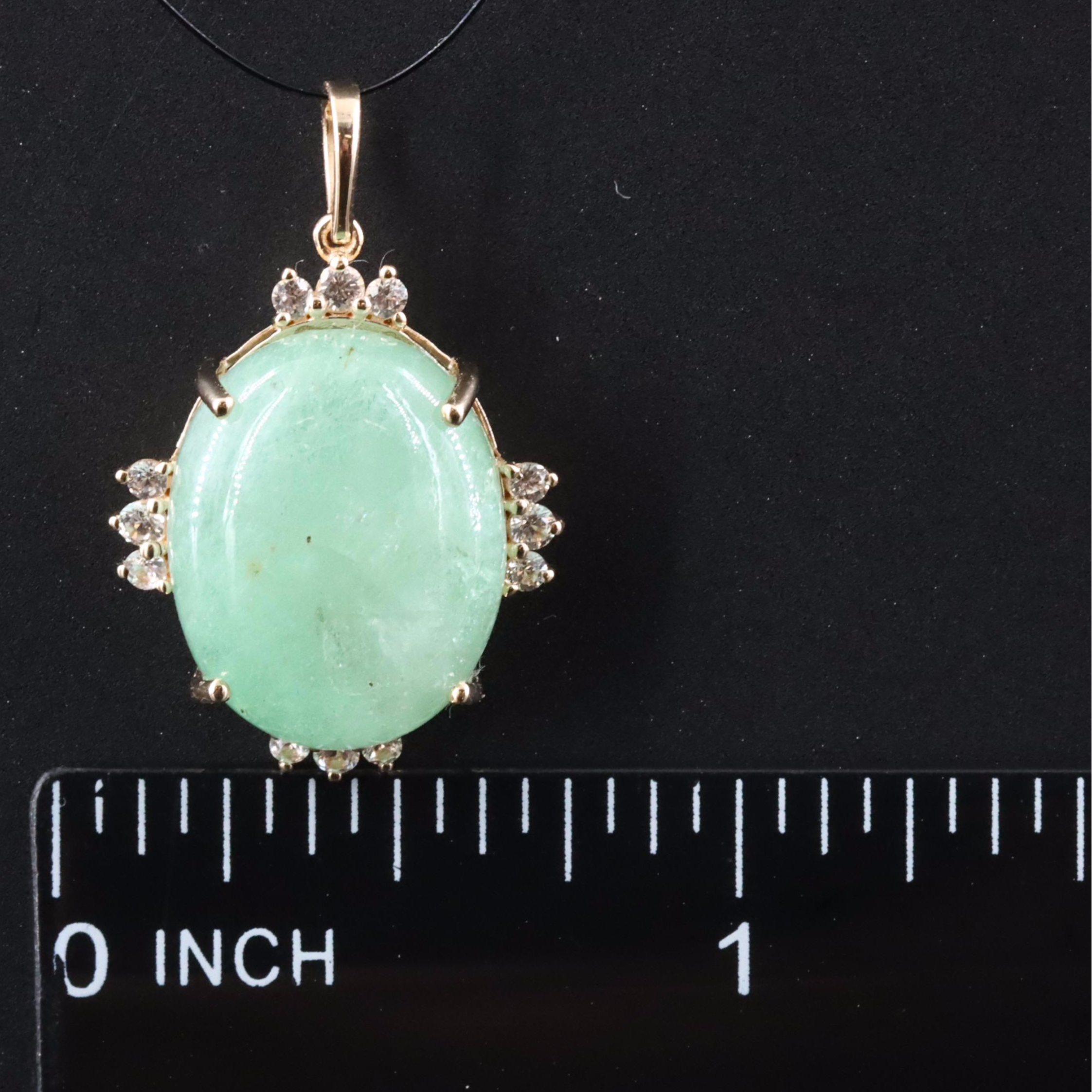 14K 10.96 CT Emerald Pendant with White Sapphire and White Topaz Accents