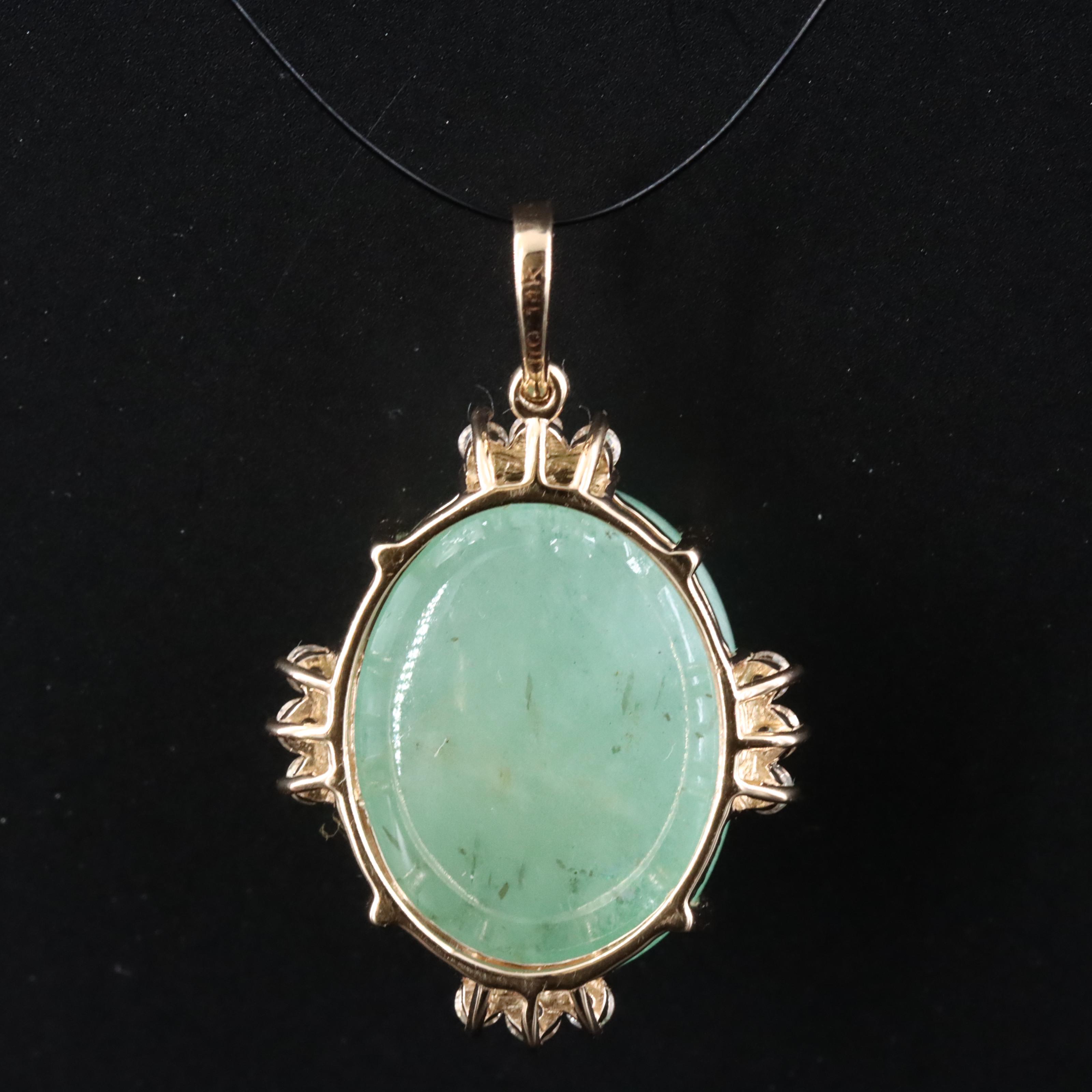 14K 10.96 CT Emerald Pendant with White Sapphire and White Topaz Accents