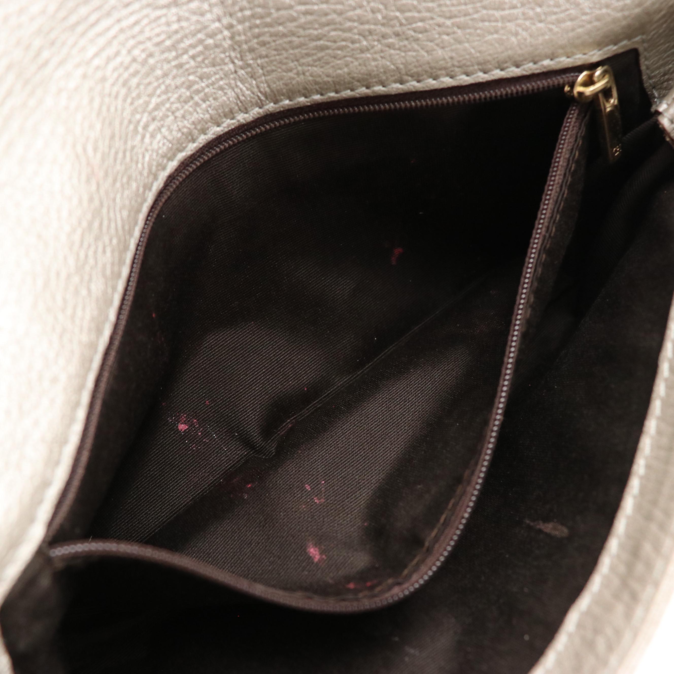 Carolina Herrera Audrey Bow Clutch in Silver Metallic Embossed Calfskin Leather