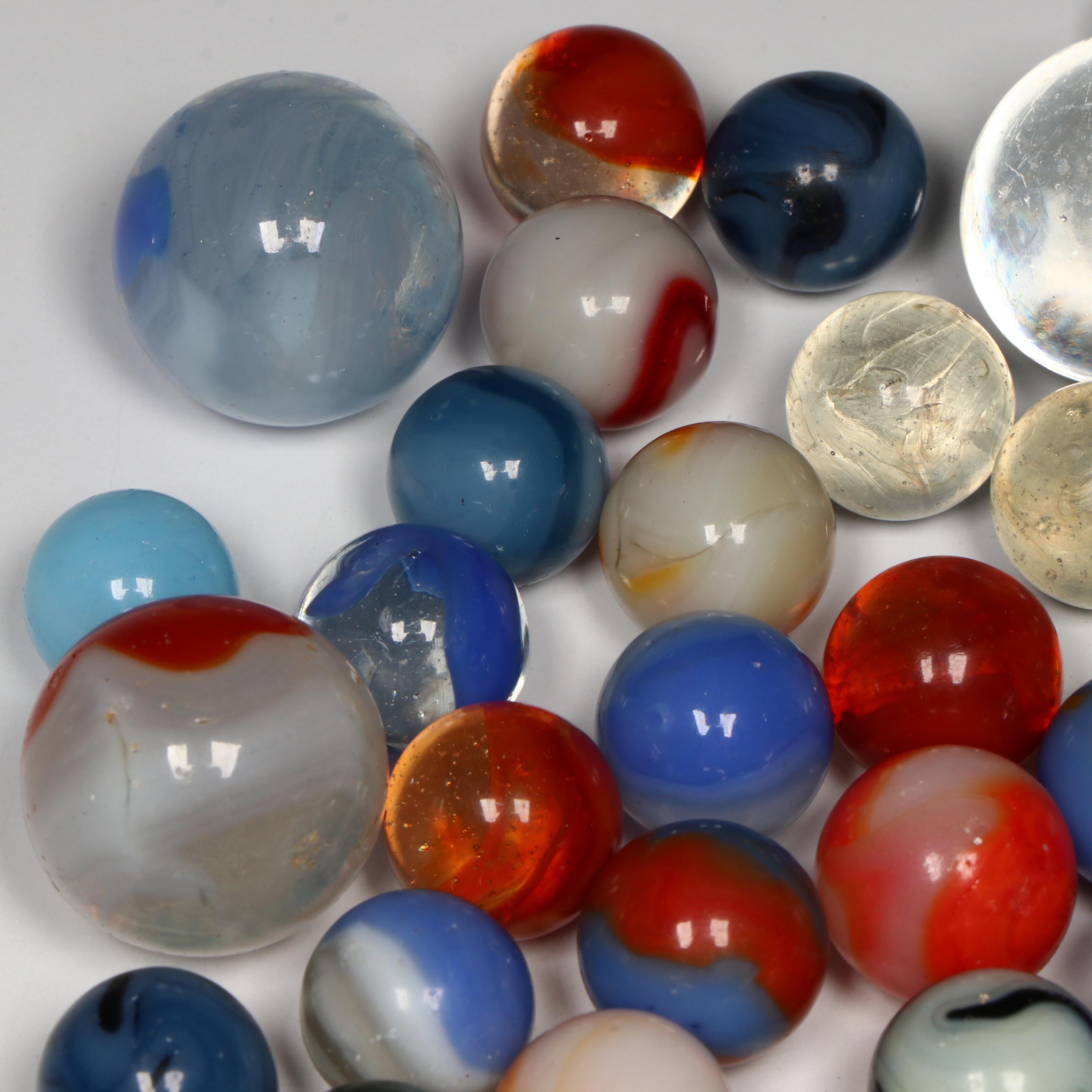 Akro Agate, Uranium Glass, and Other Glass Marbles with McDonald's Paperweight