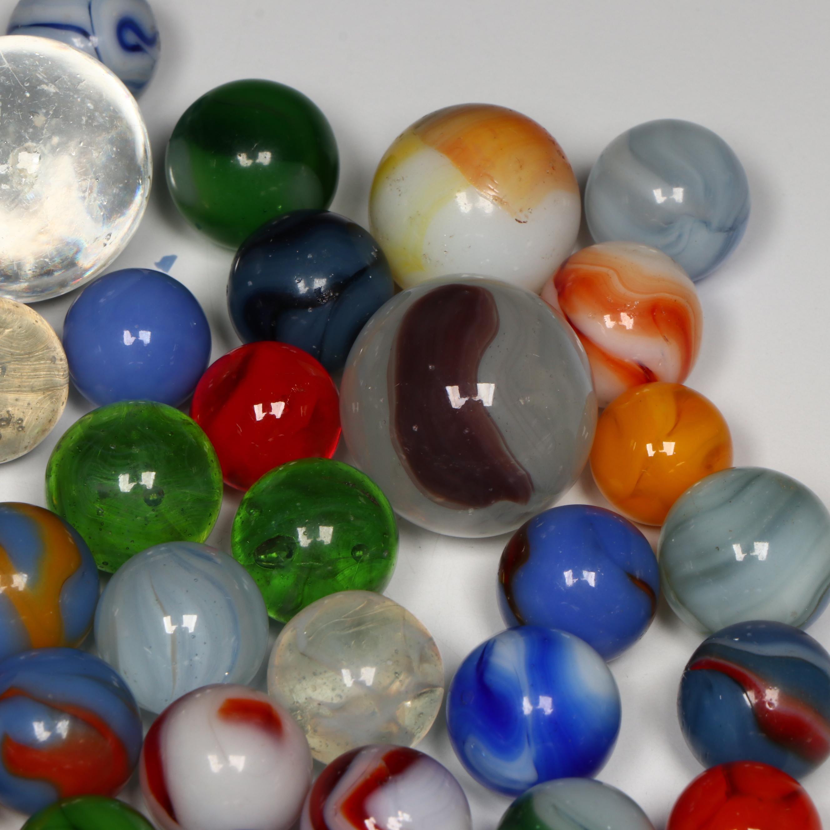 Akro Agate, Uranium Glass, and Other Glass Marbles with McDonald's Paperweight