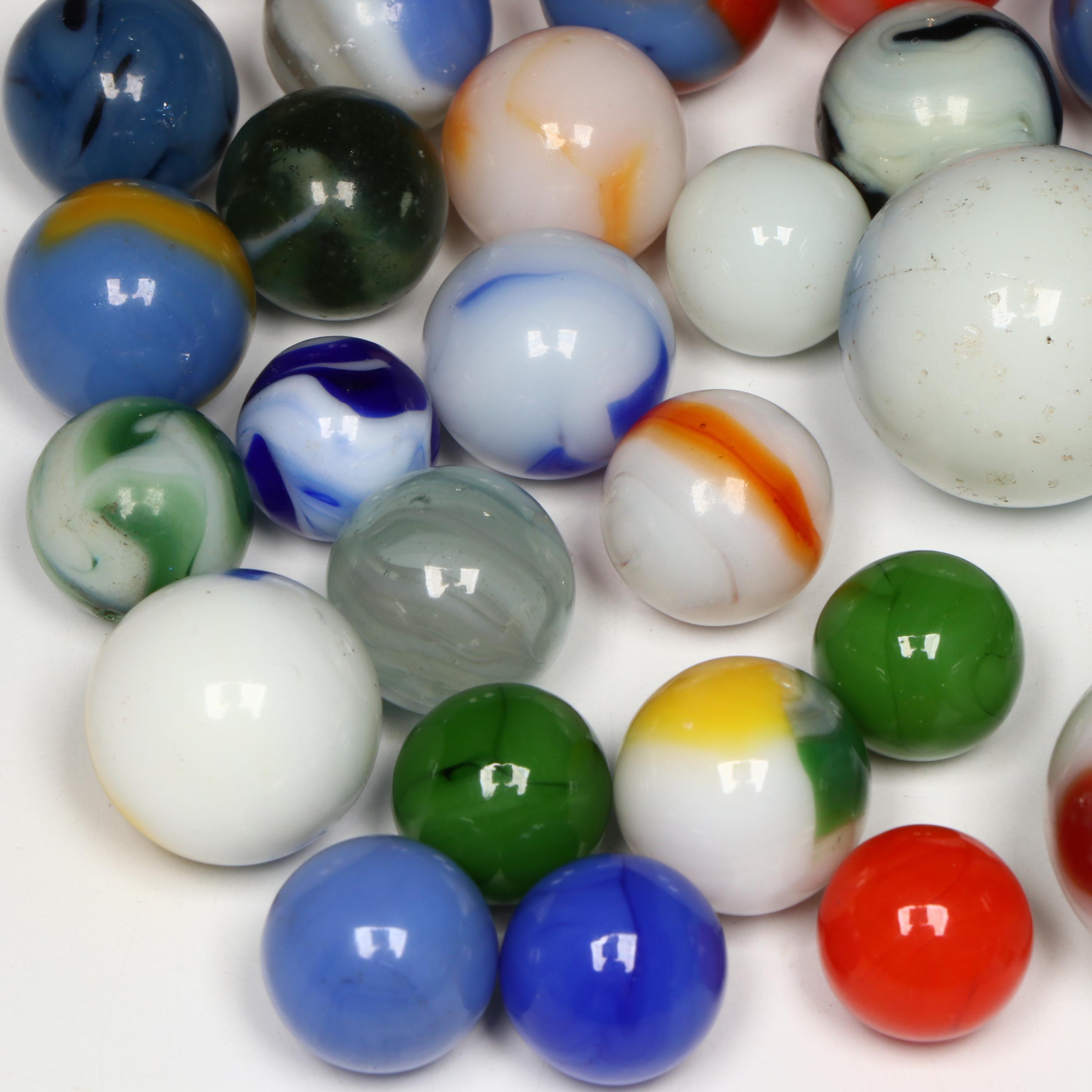 Akro Agate, Uranium Glass, and Other Glass Marbles with McDonald's Paperweight