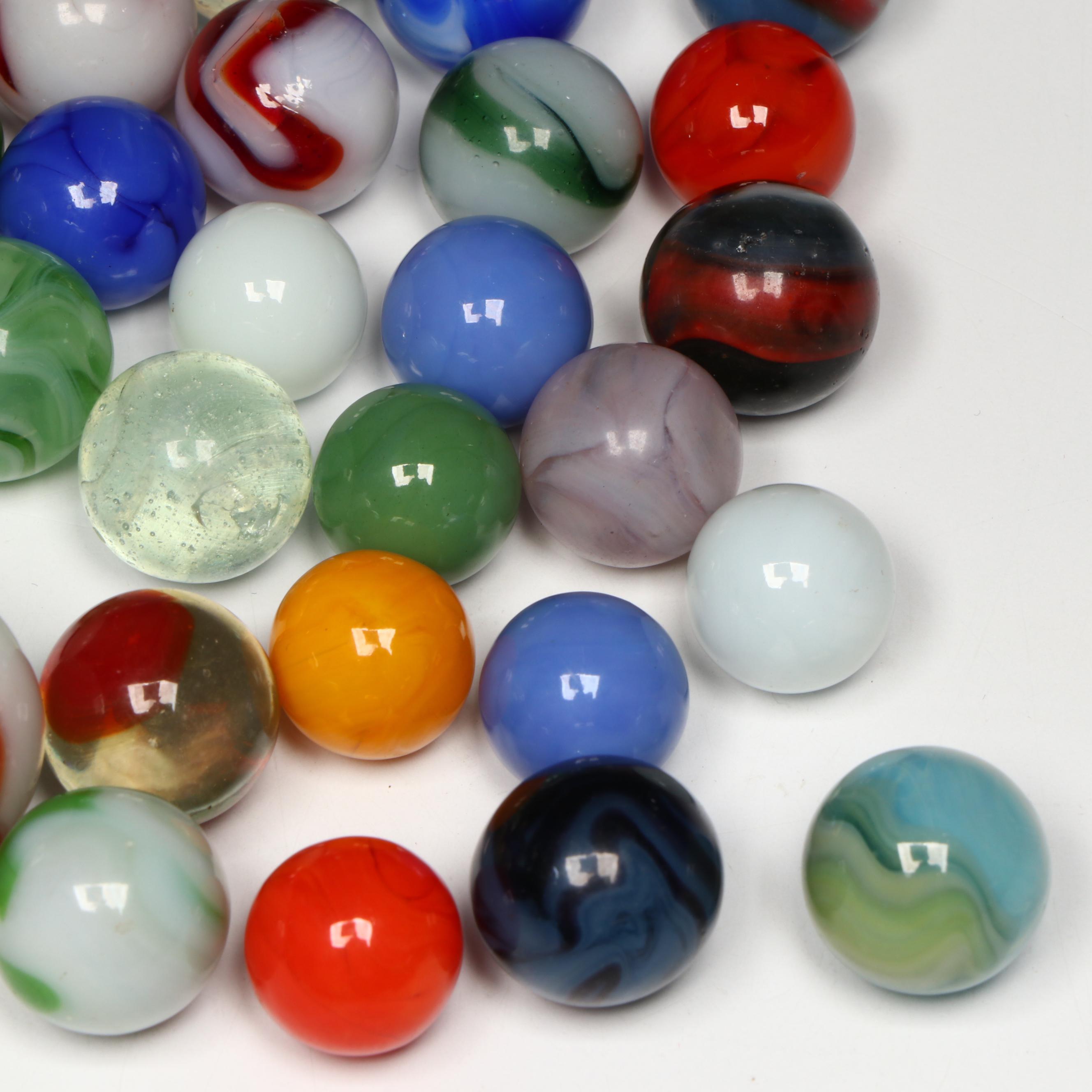 Akro Agate, Uranium Glass, and Other Glass Marbles with McDonald's Paperweight