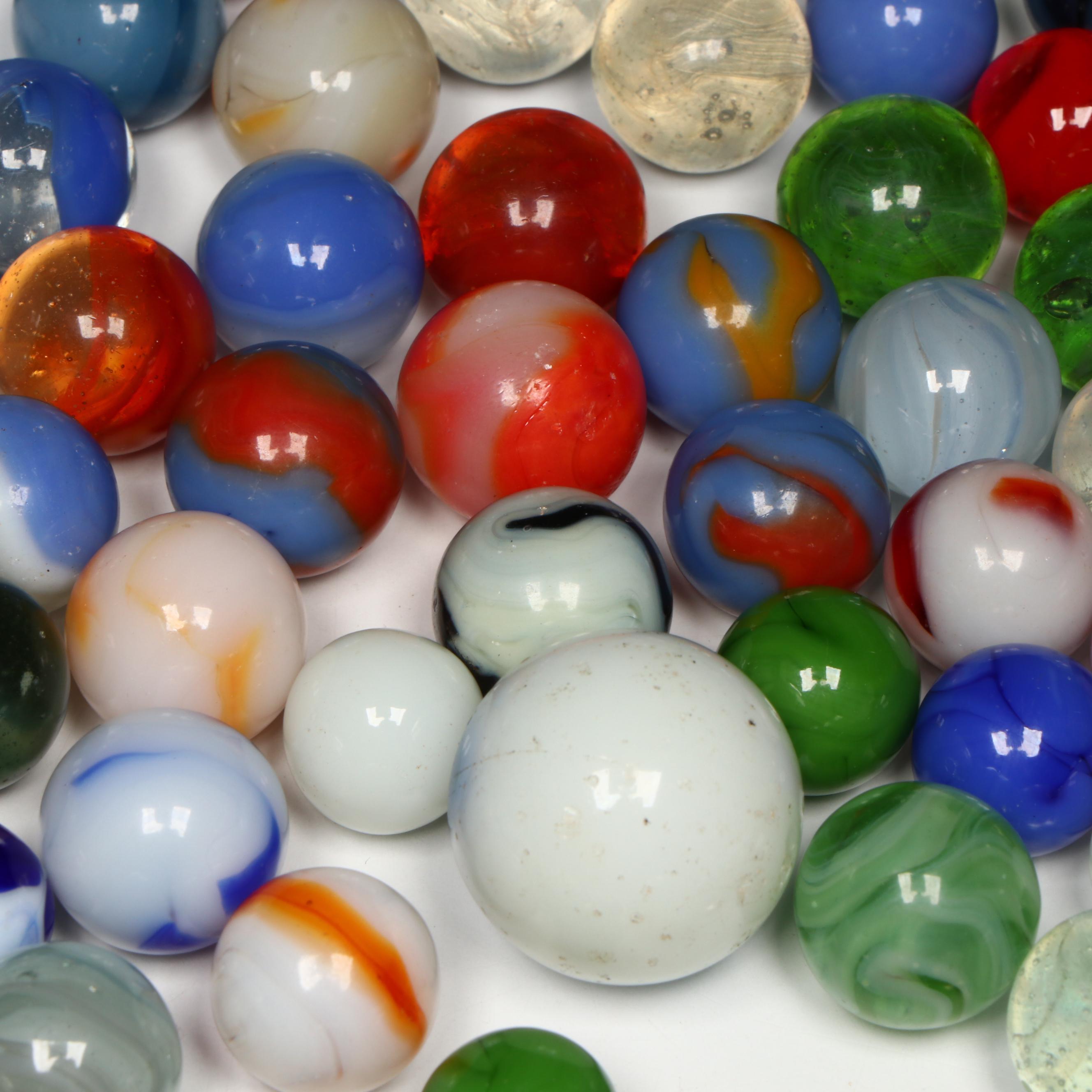 Akro Agate, Uranium Glass, and Other Glass Marbles with McDonald's Paperweight