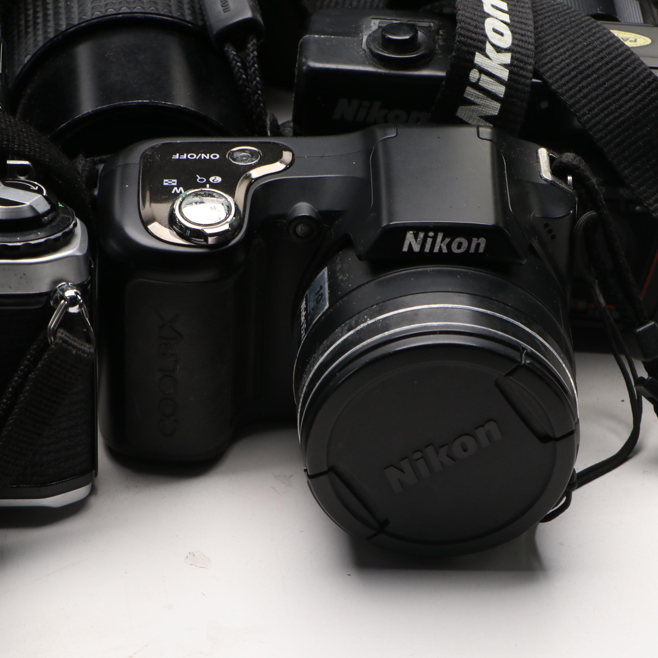 Collection of SLR Film Cameras with Hard Case and Other Accessories