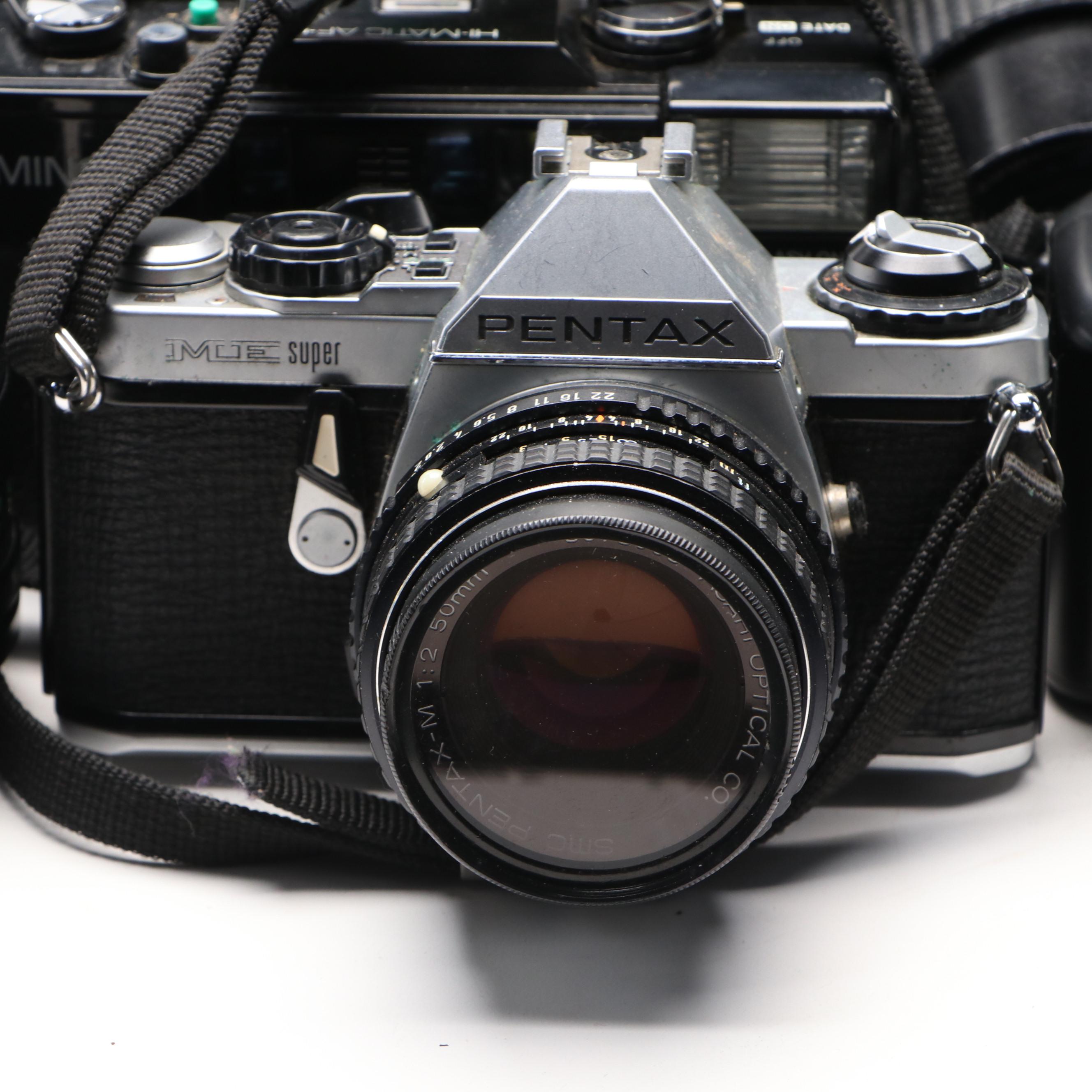 Collection of SLR Film Cameras with Hard Case and Other Accessories
