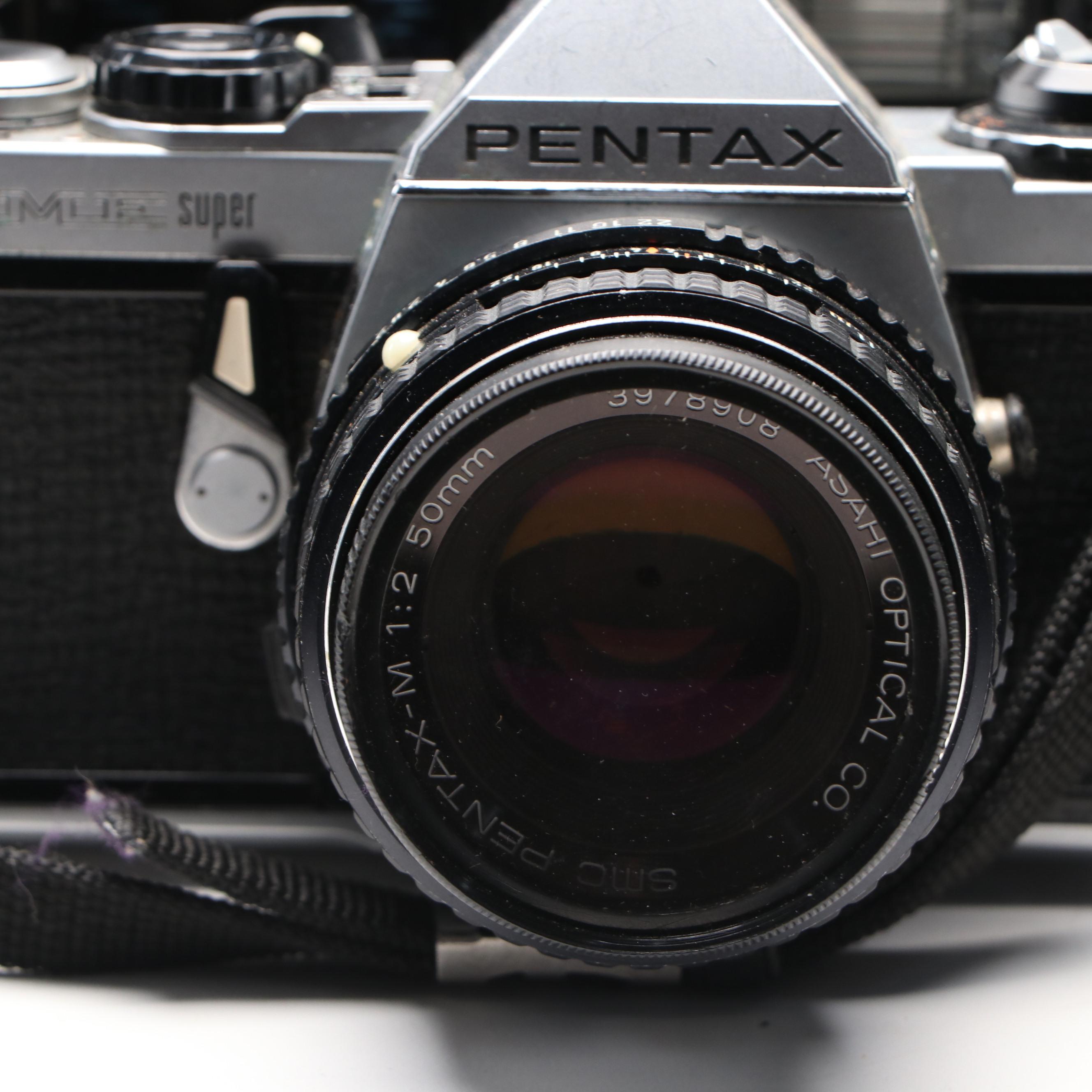 Collection of SLR Film Cameras with Hard Case and Other Accessories
