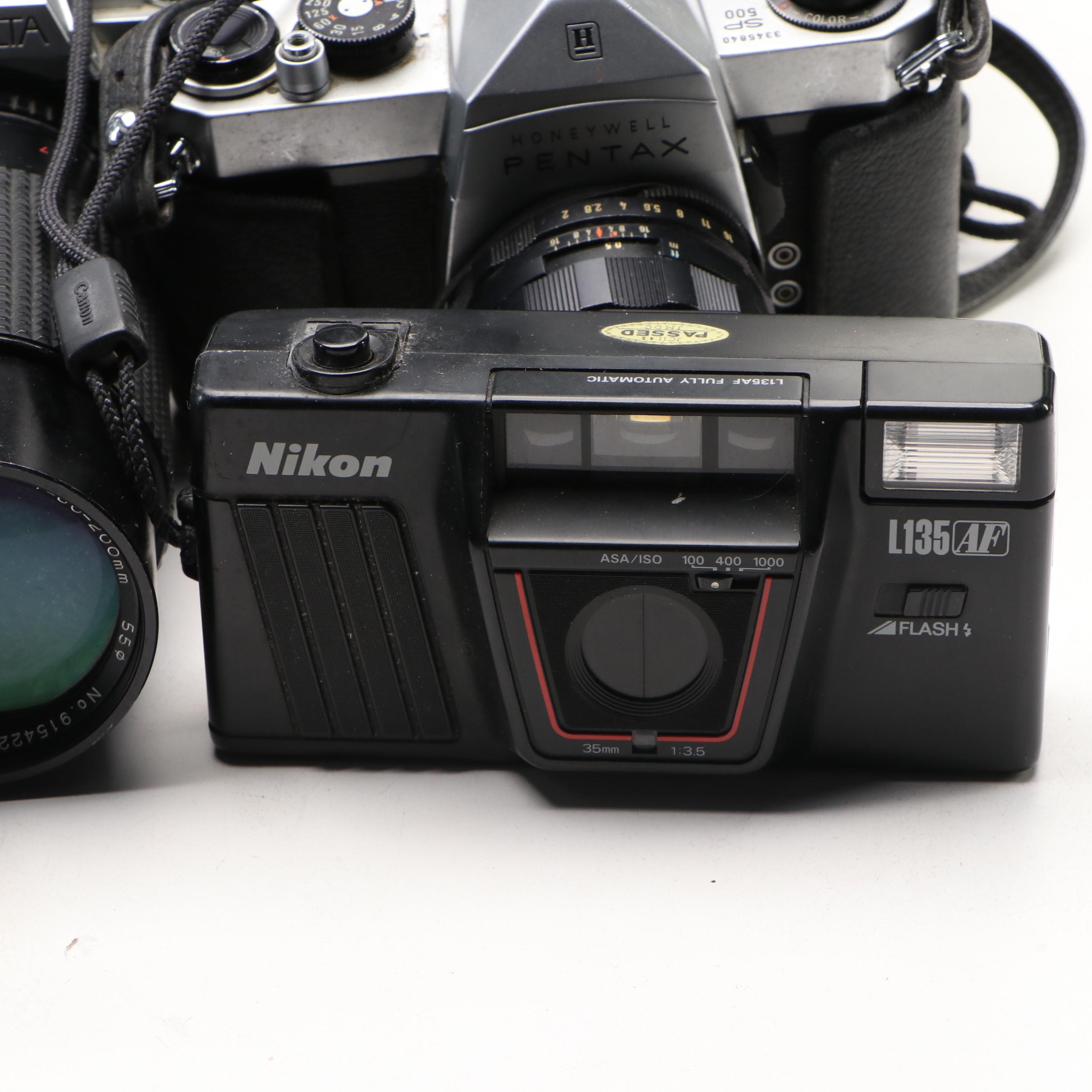 Collection of SLR Film Cameras with Hard Case and Other Accessories