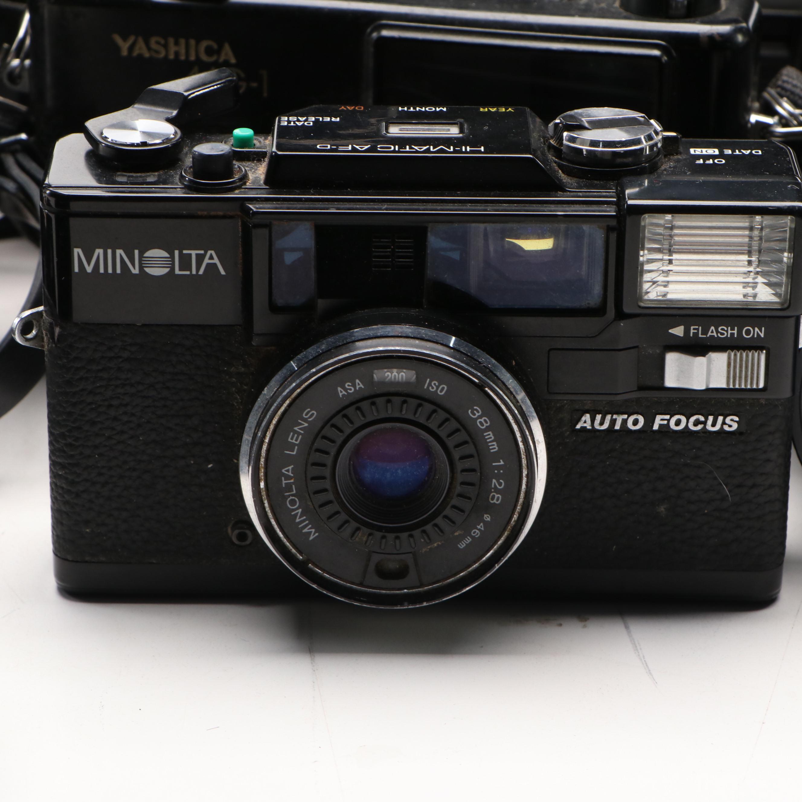 Collection of SLR Film Cameras with Hard Case and Other Accessories