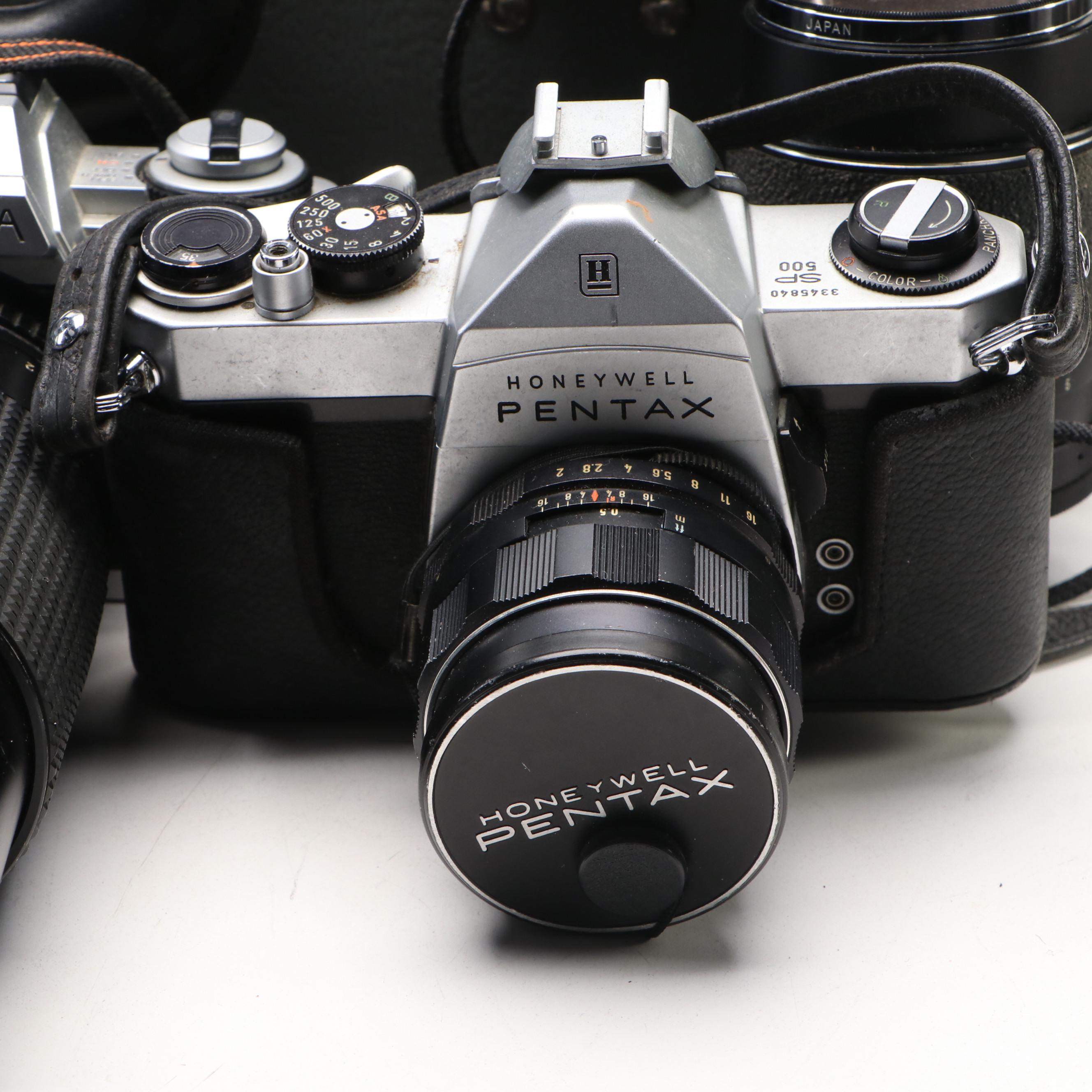 Collection of SLR Film Cameras with Hard Case and Other Accessories