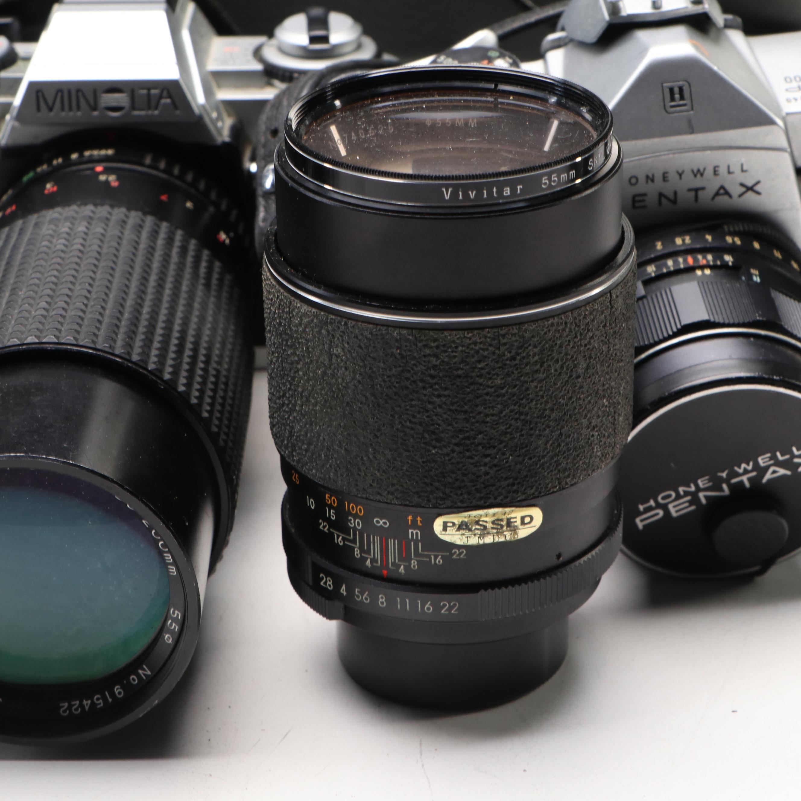 Collection of SLR Film Cameras with Hard Case and Other Accessories