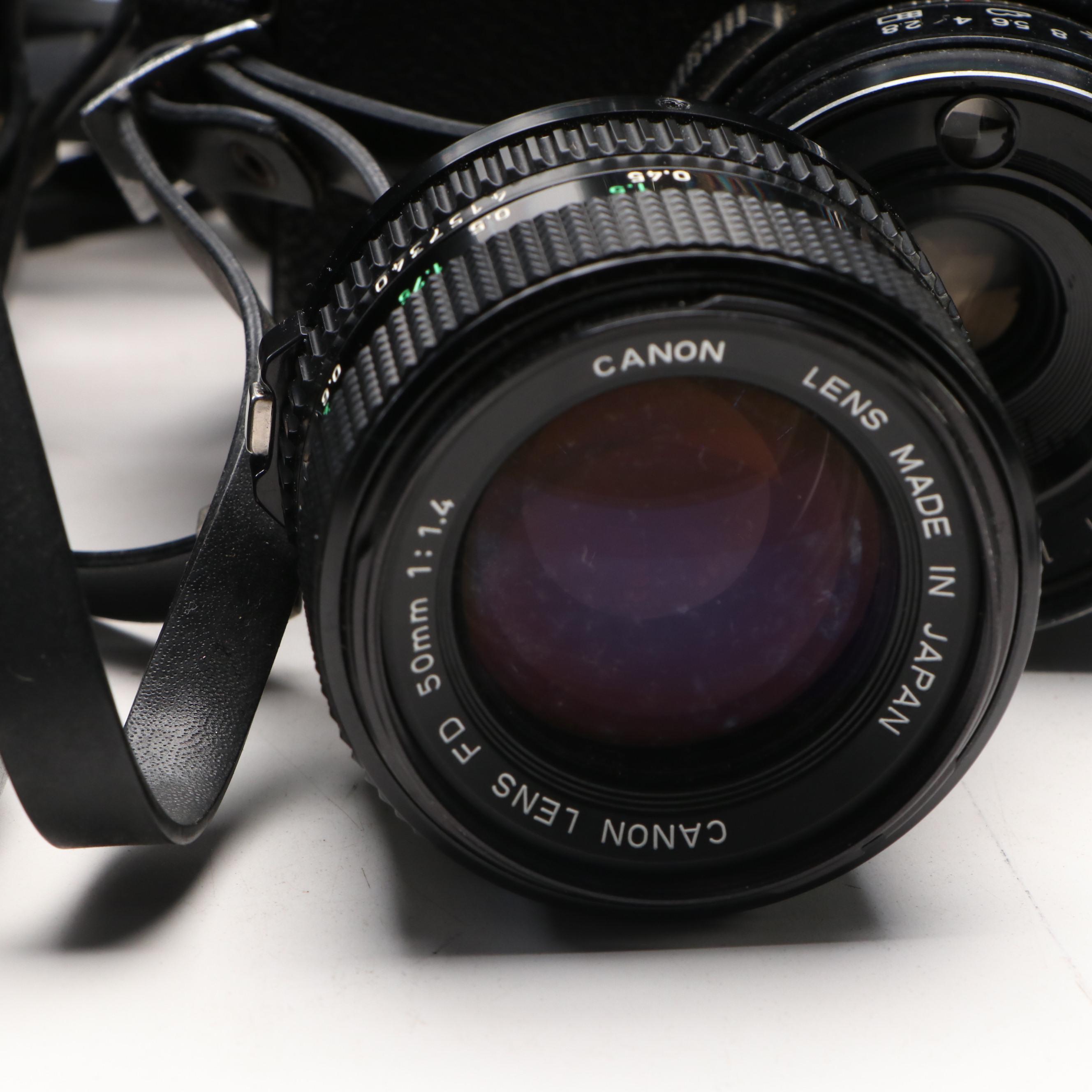 Collection of SLR Film Cameras with Hard Case and Other Accessories