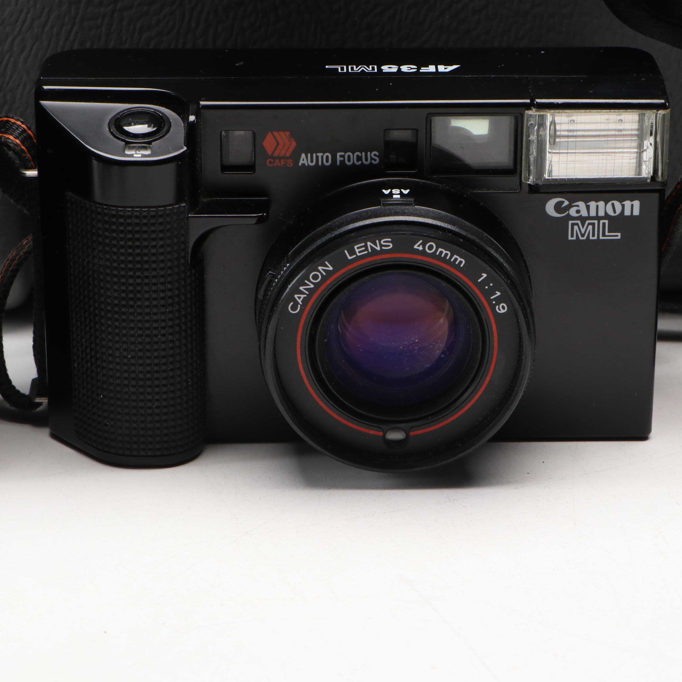 Collection of SLR Film Cameras with Hard Case and Other Accessories