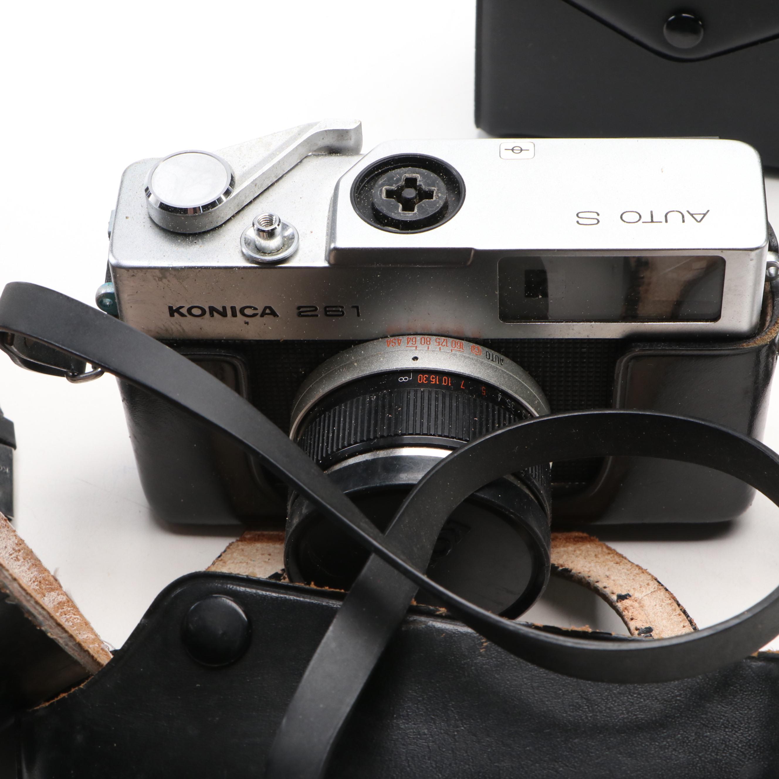 Collection of SLR Film Cameras with Hard Case and Other Accessories