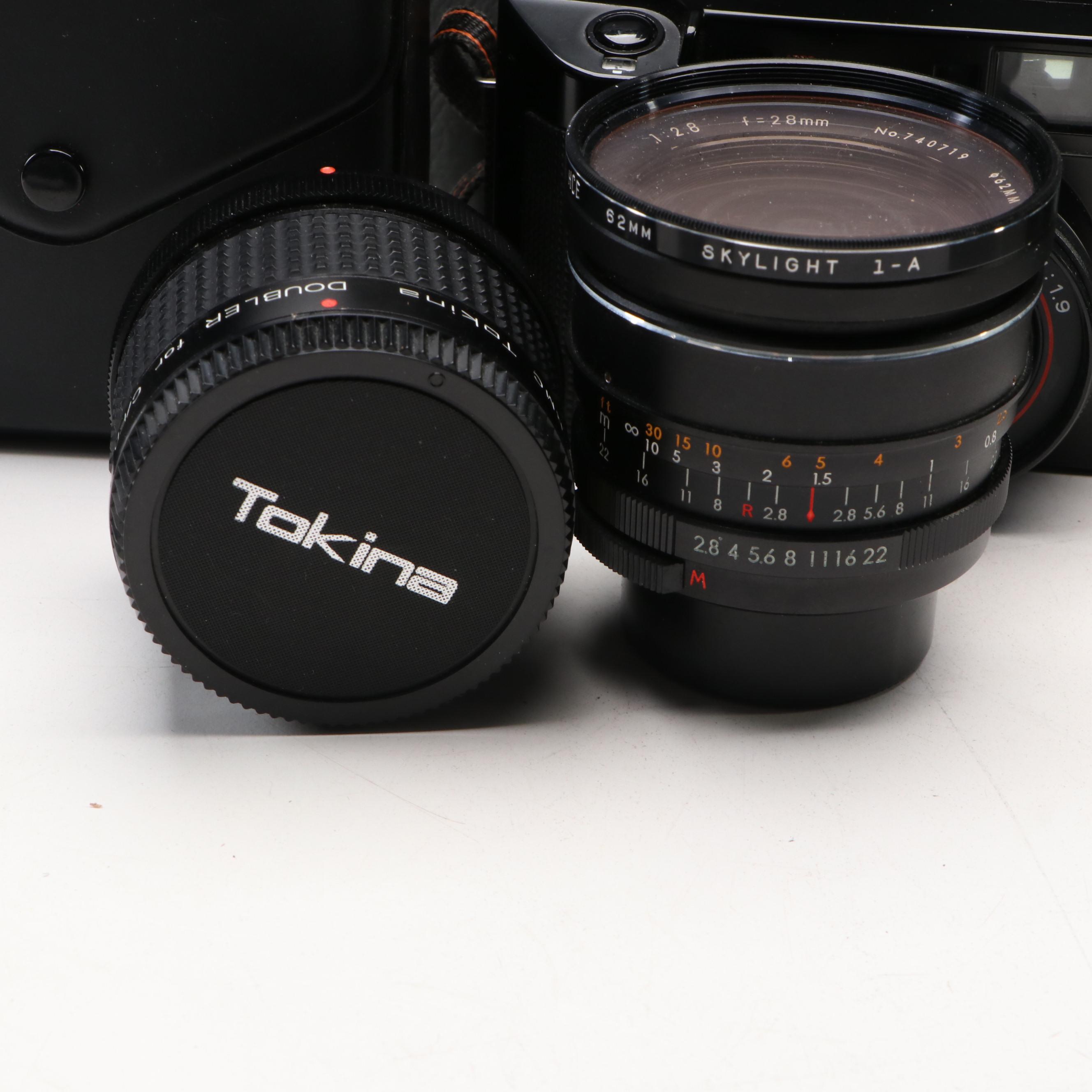 Collection of SLR Film Cameras with Hard Case and Other Accessories