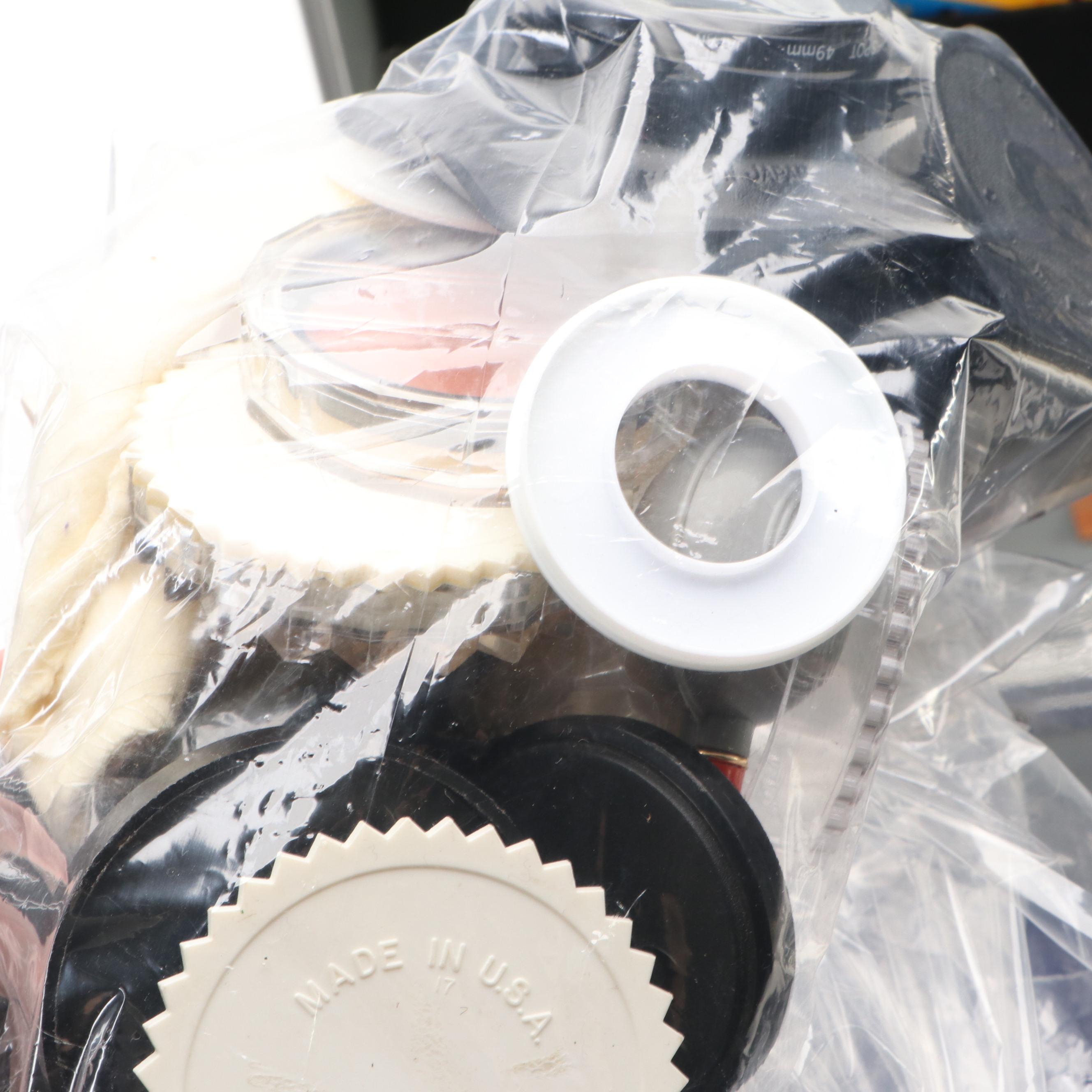 Collection of SLR Film Cameras with Hard Case and Other Accessories