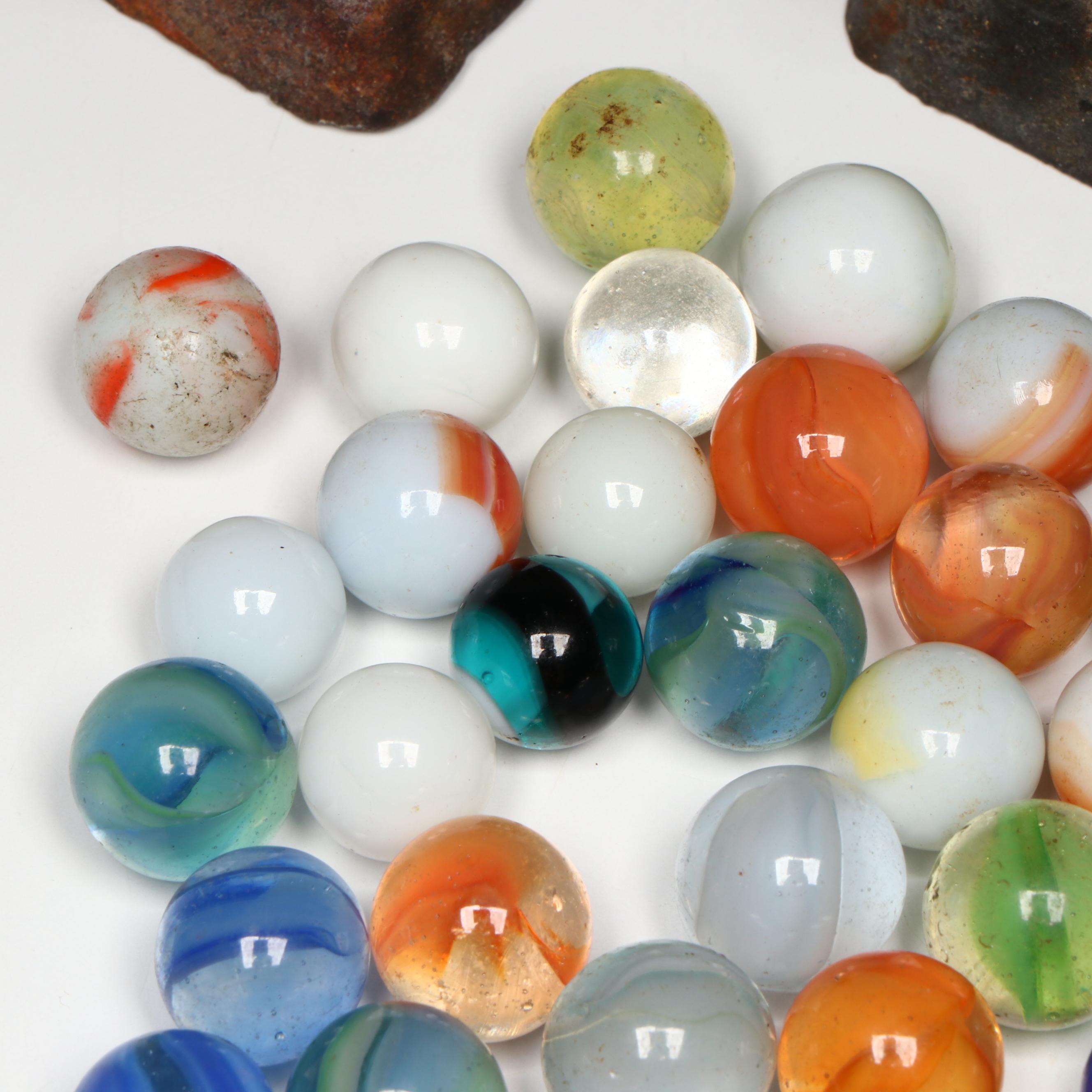 Uranium Glass, Cat's Eye and Other Marbles with Cast Iron Dogs and Cat