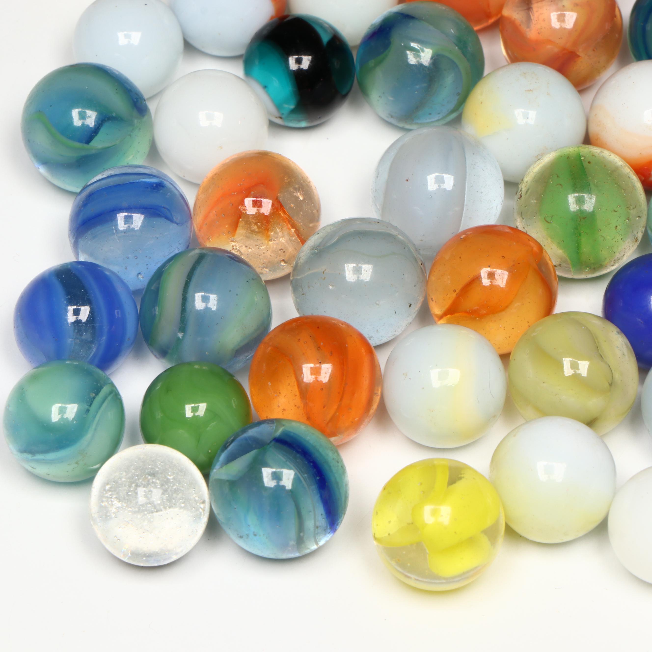 Uranium Glass, Cat's Eye and Other Marbles with Cast Iron Dogs and Cat