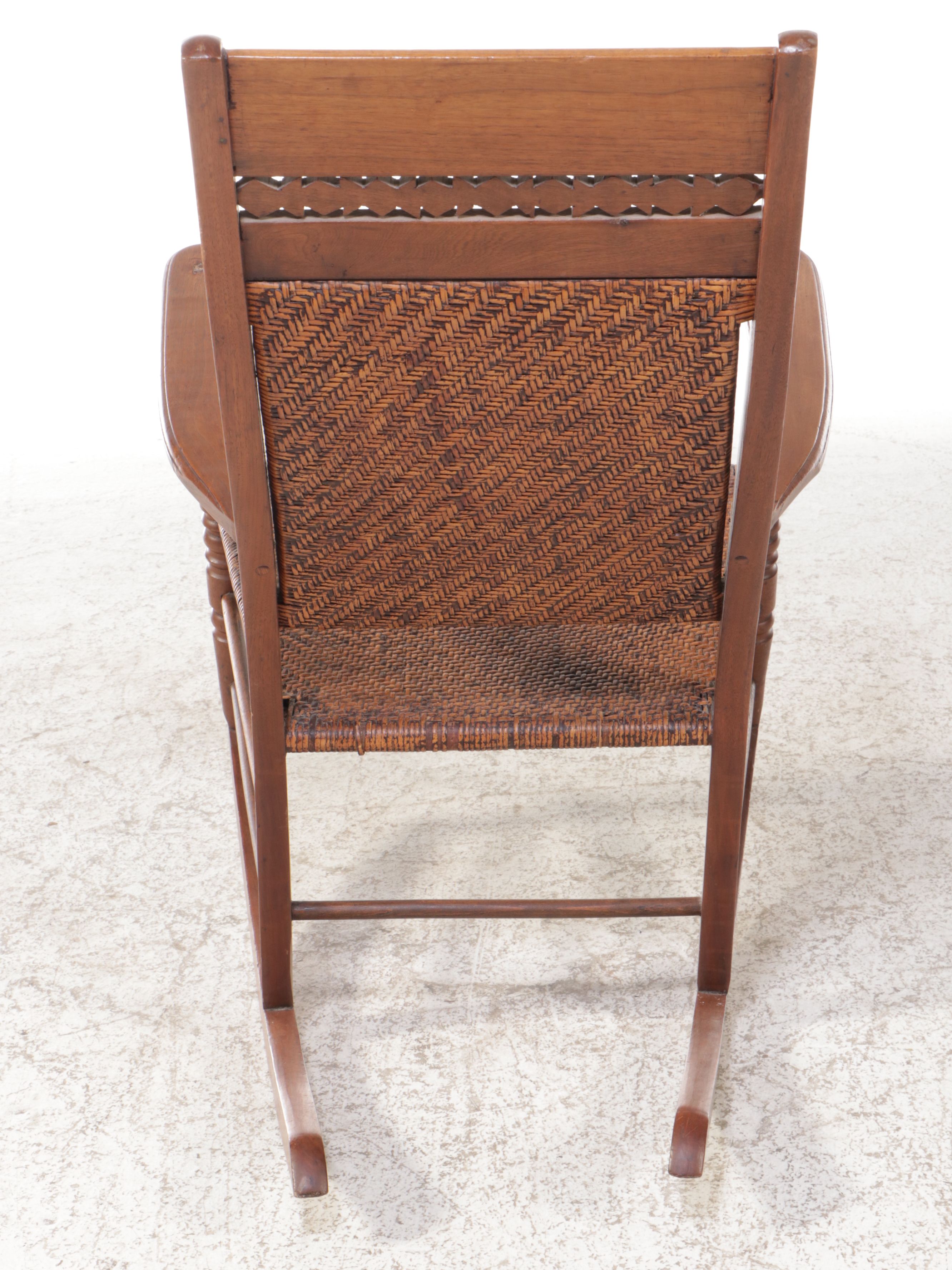 Victorian East Lake Rattan and Carved Walnut Rocking Chair