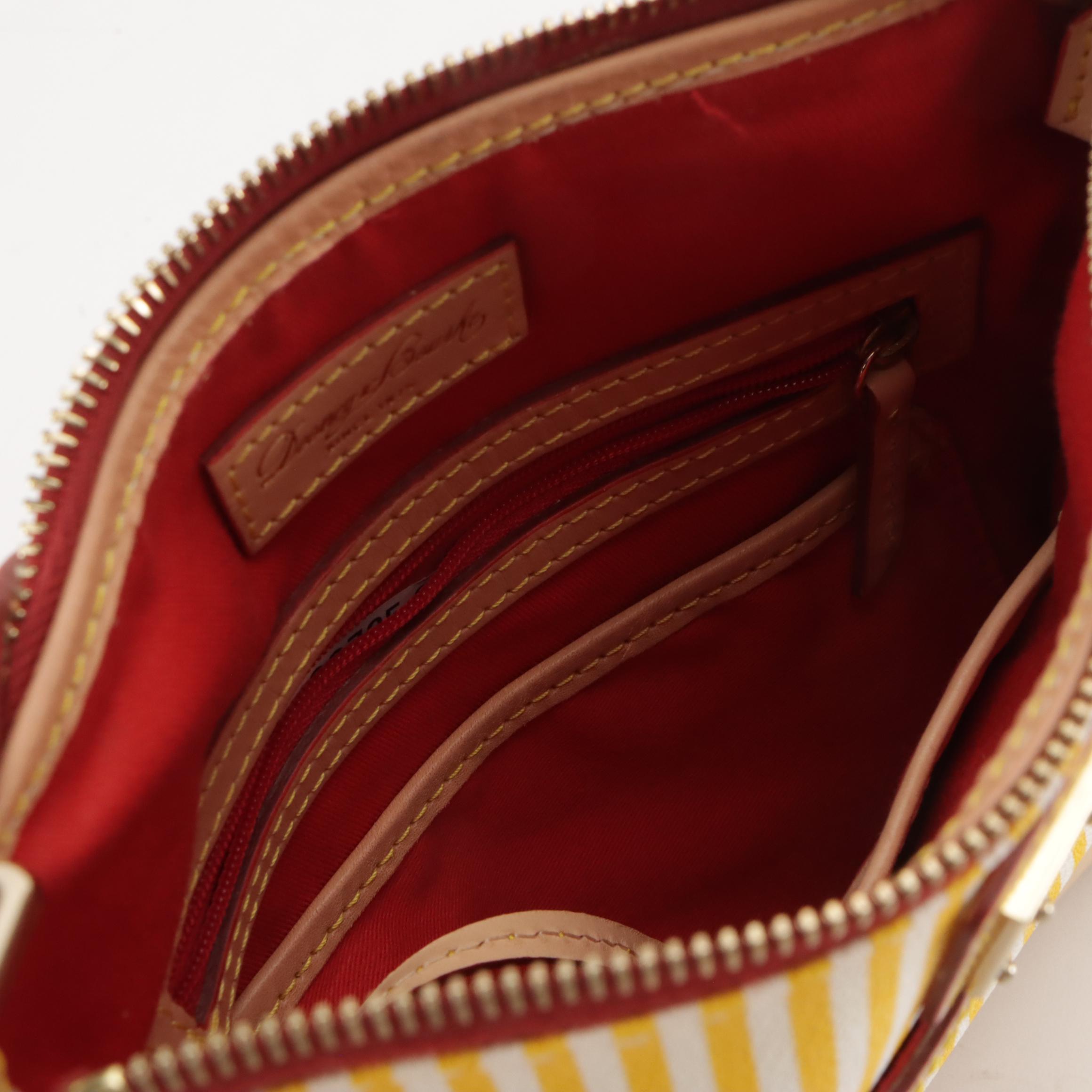 Dooney & Bourke Wristlet and Crossbody Bags in Logo/Striped Coated Canvas