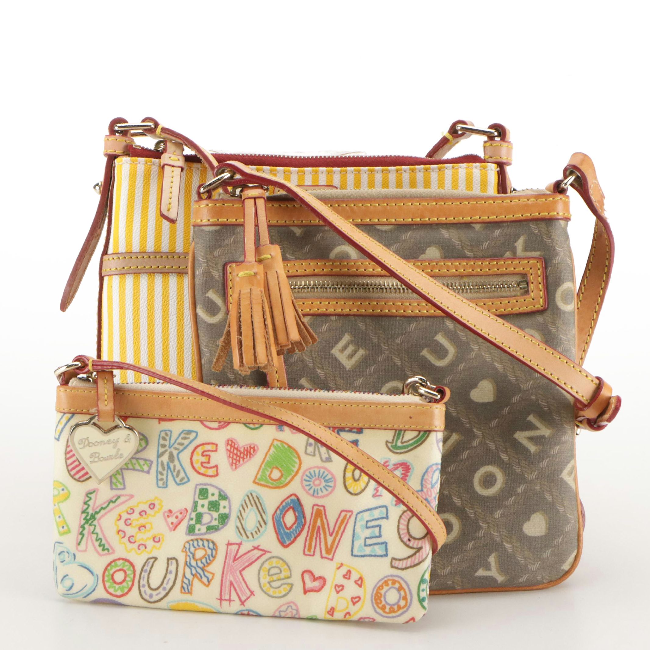 Dooney & Bourke Wristlet and Crossbody Bags in Logo/Striped Coated Canvas