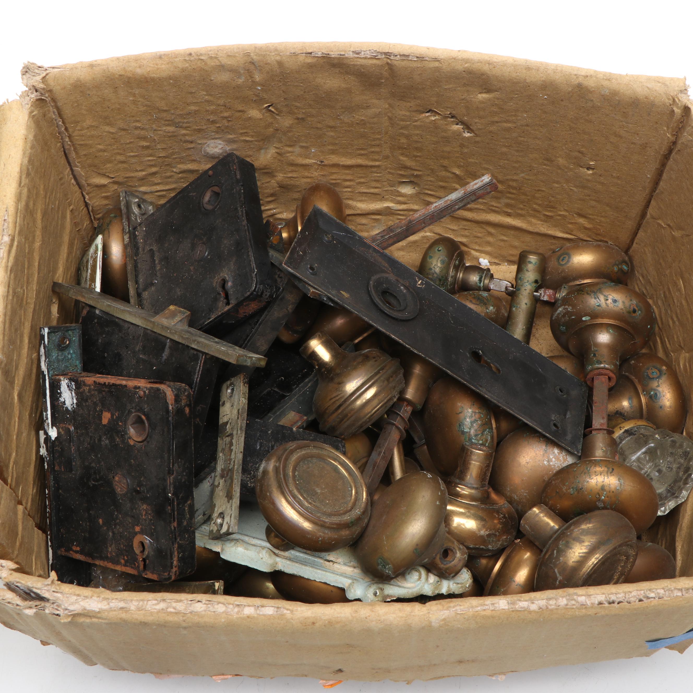 Assortment of Vintage Brass, Metal, and Wood Doorknobs with Cast Iron Locks