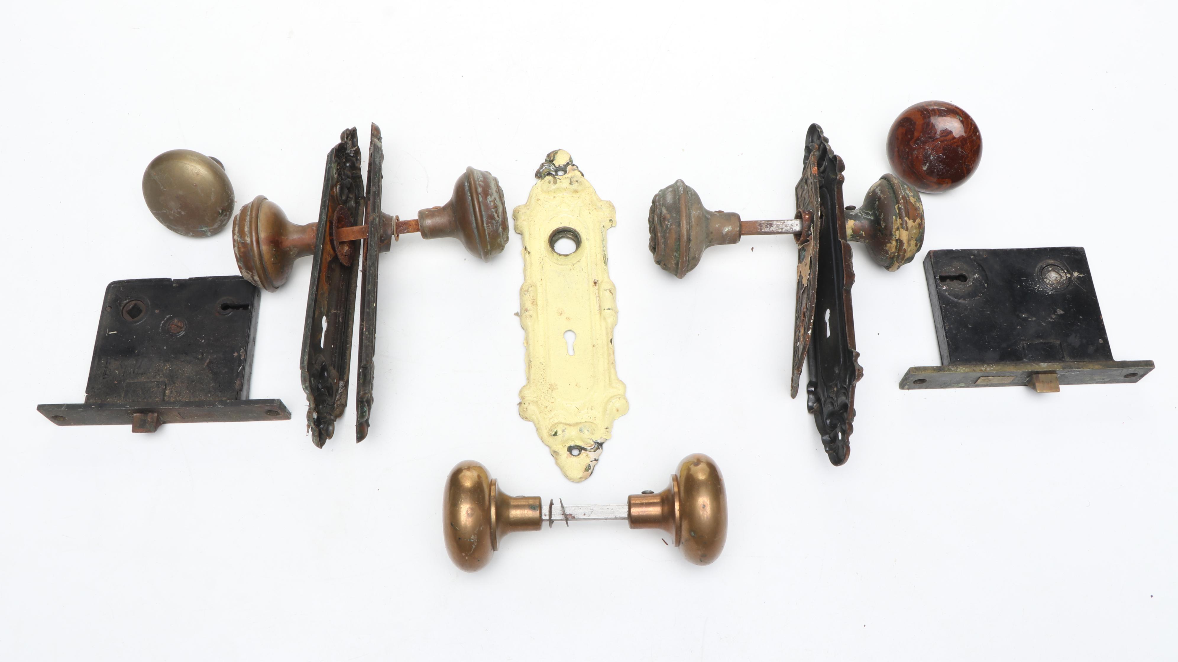 Assortment of Vintage Brass, Metal, and Wood Doorknobs with Cast Iron Locks