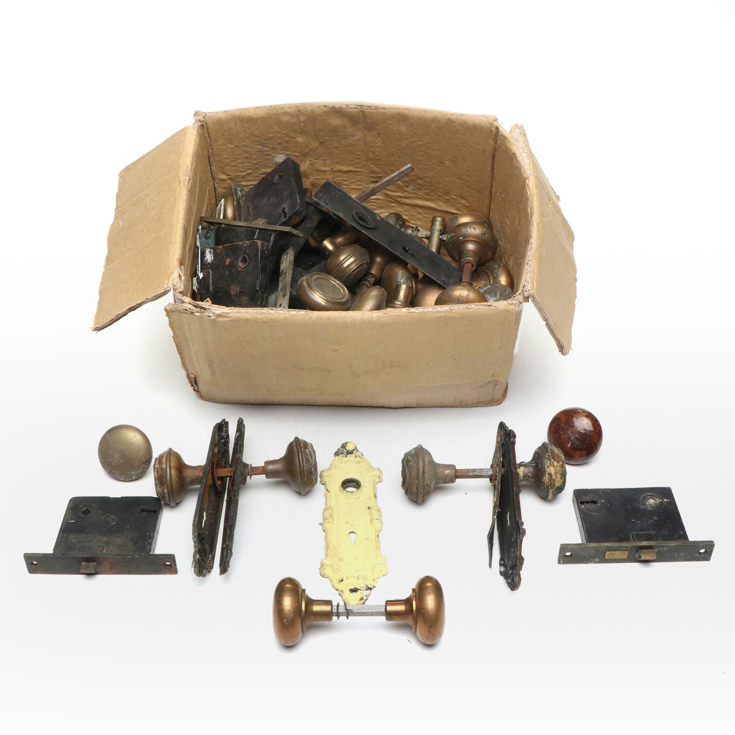 Assortment of Vintage Brass, Metal, and Wood Doorknobs with Cast Iron Locks