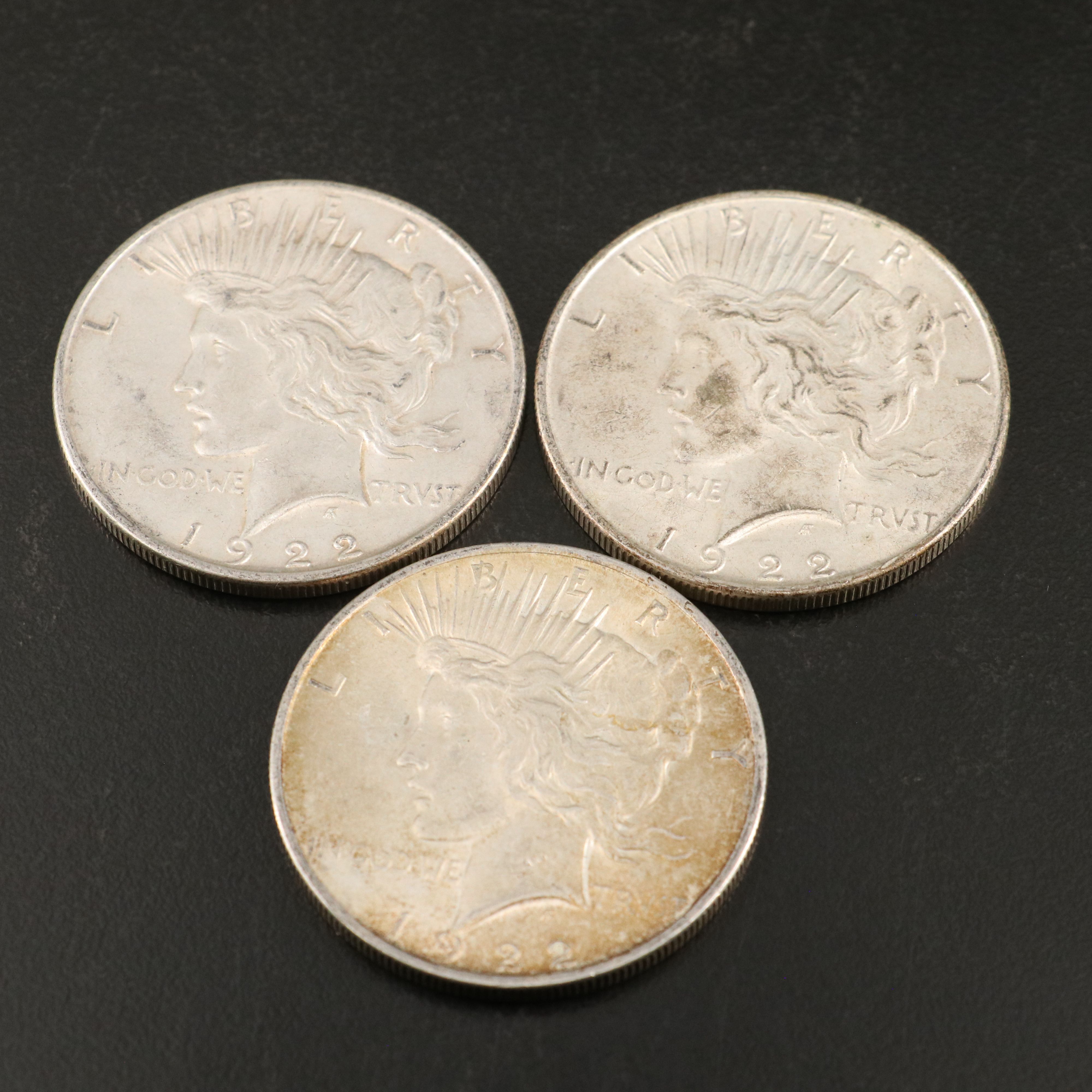 Eleven Peace Silver Dollars