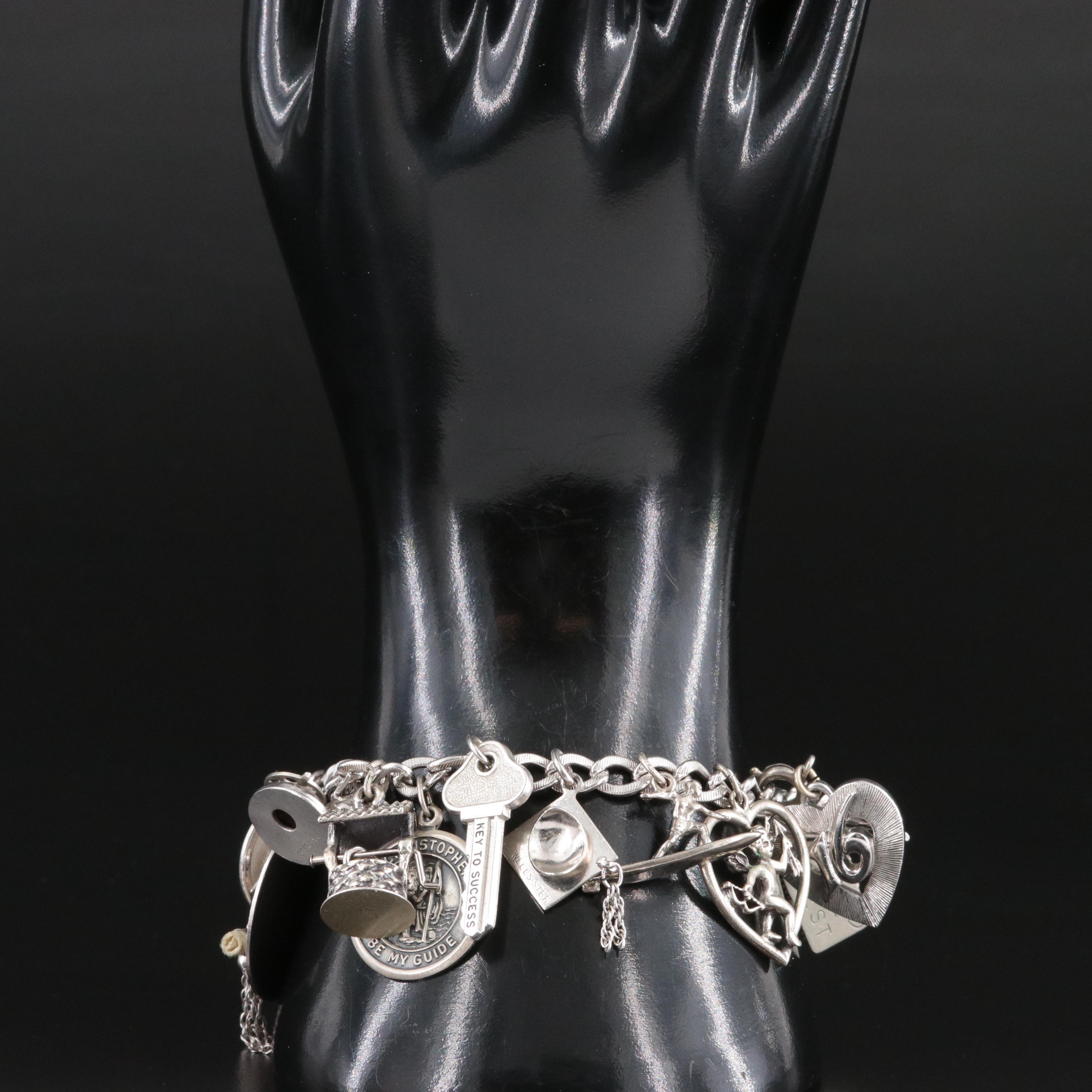 Vintage Sterling Charm Bracelet Featuring Articulated Charms