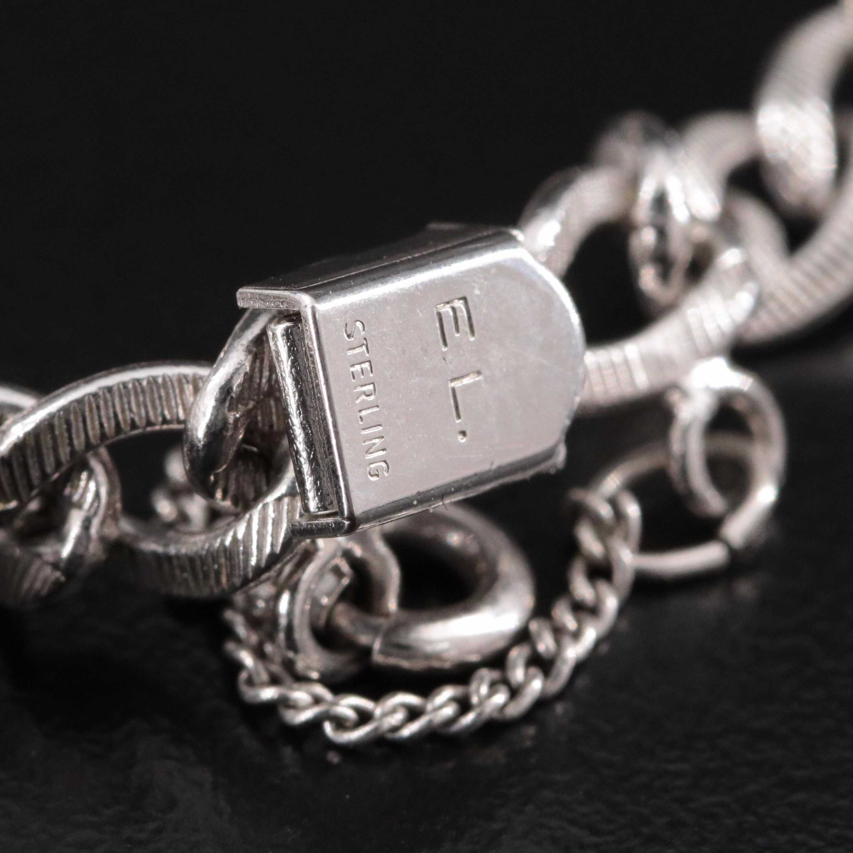 Vintage Sterling Charm Bracelet Featuring Articulated Charms