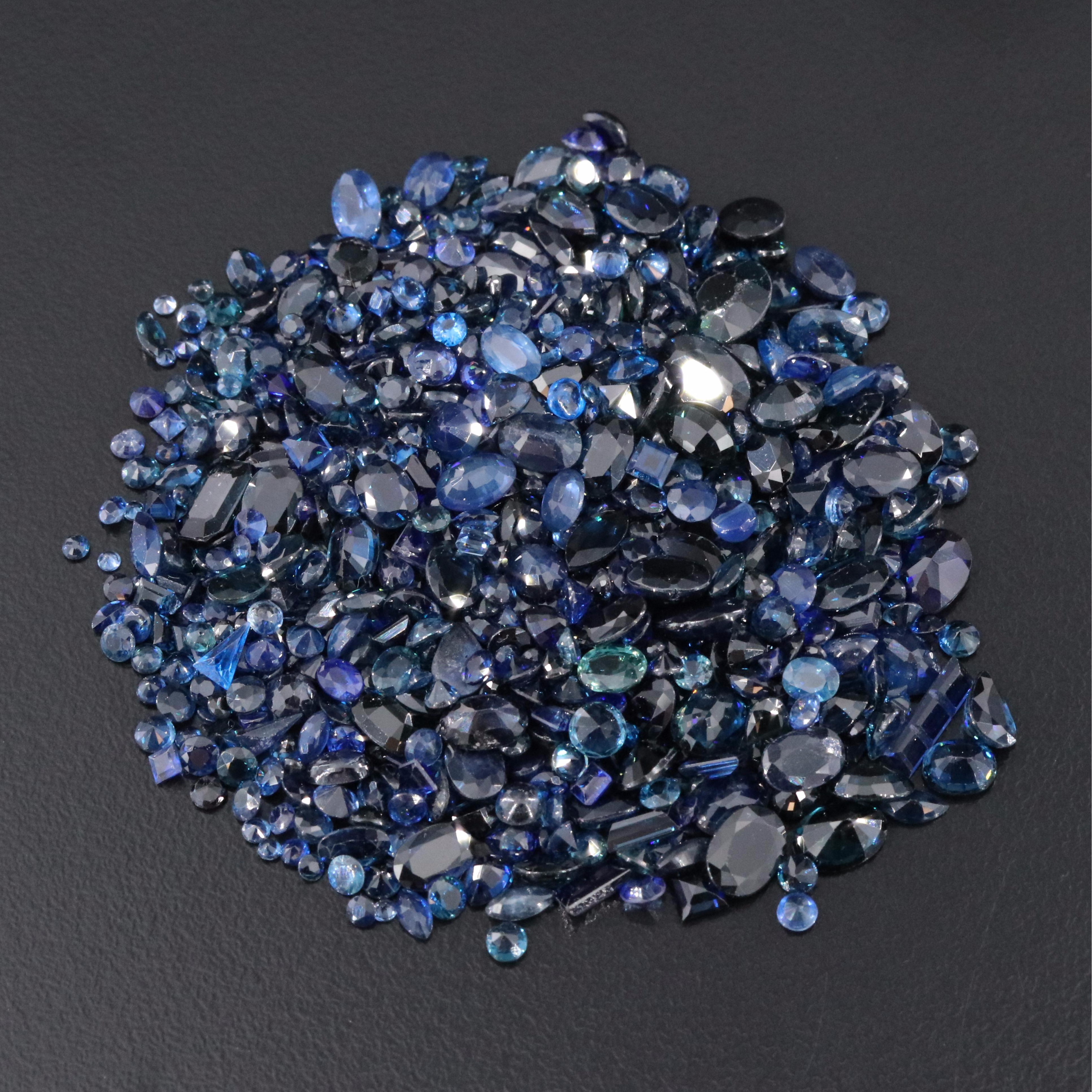 Loose 120.92 CTW Gemstone Lot Including Sapphire, Lab Grown Spinel and Glass