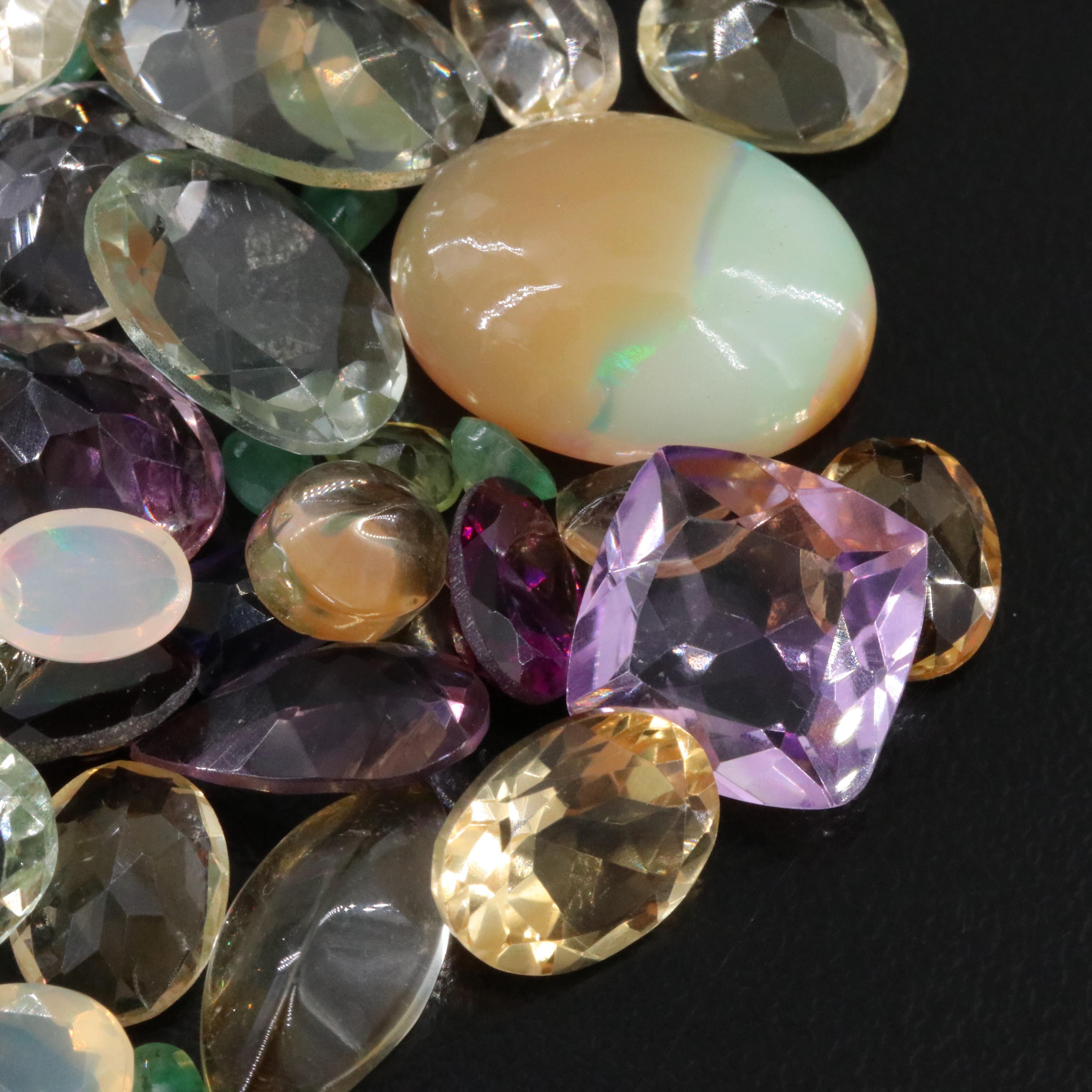 Loose 158.98 CTW Gemstone Lot Including Emerald, Opal and Amethyst