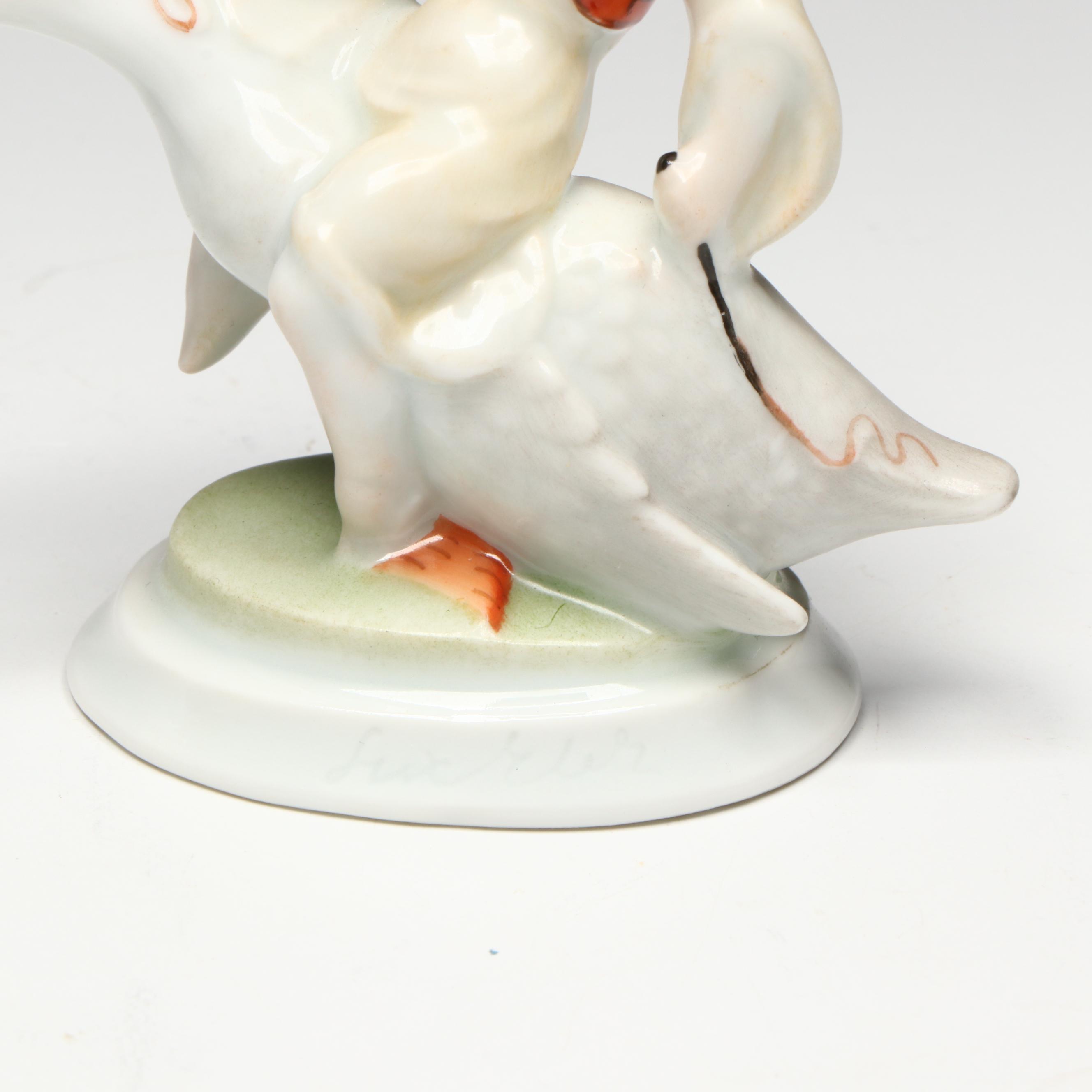 Pair of Herend "Boy Riding Goose" Porcelain Figurines