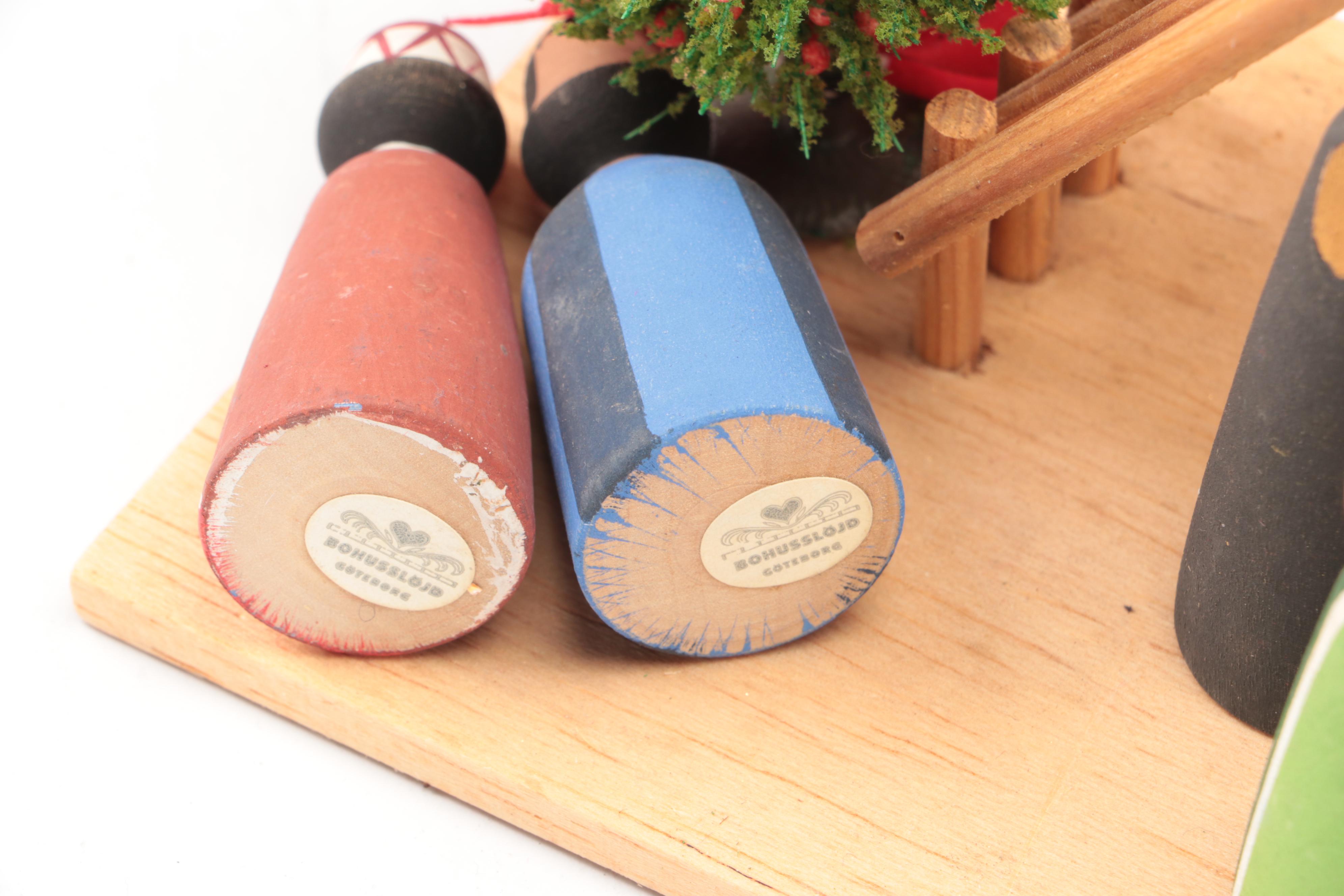 Faux Pine and Berry Wreaths, Needlepoint Textiles, and More Christmas Décor