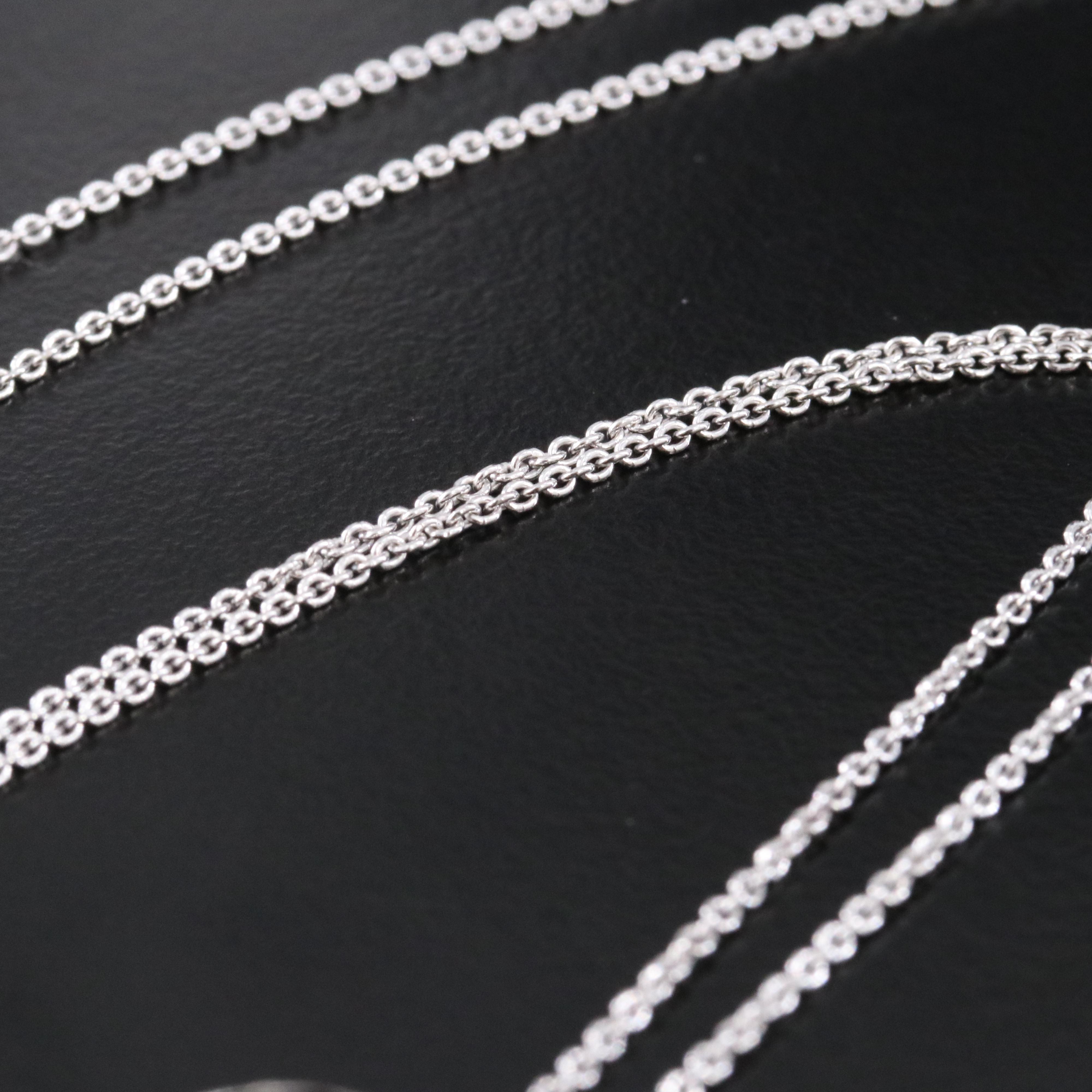 Sterling Knot Pendant Necklace with Diamond and Fancy Diamond Accents