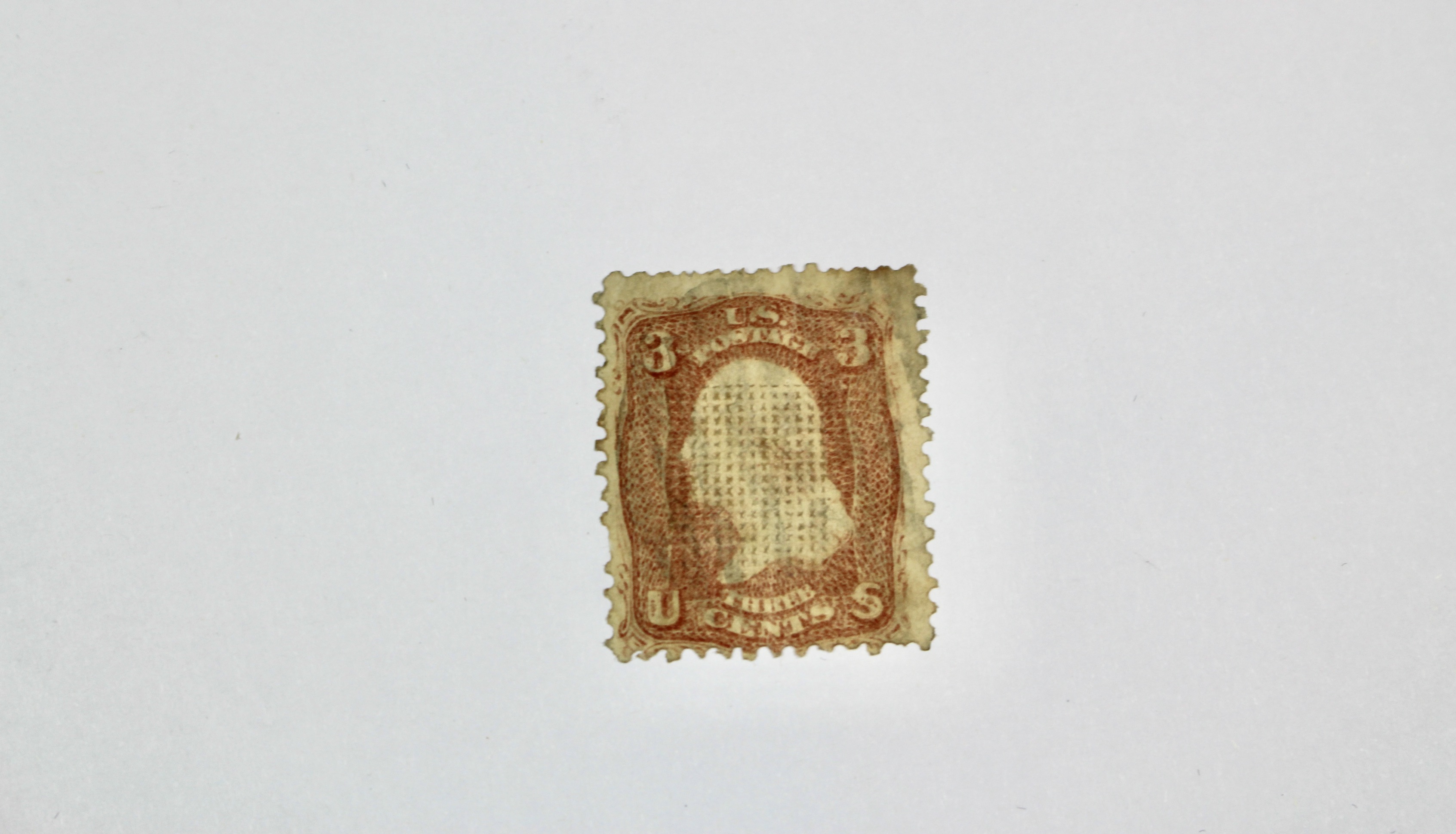 Seven Early U.S. Postage Stamps, All with Grills