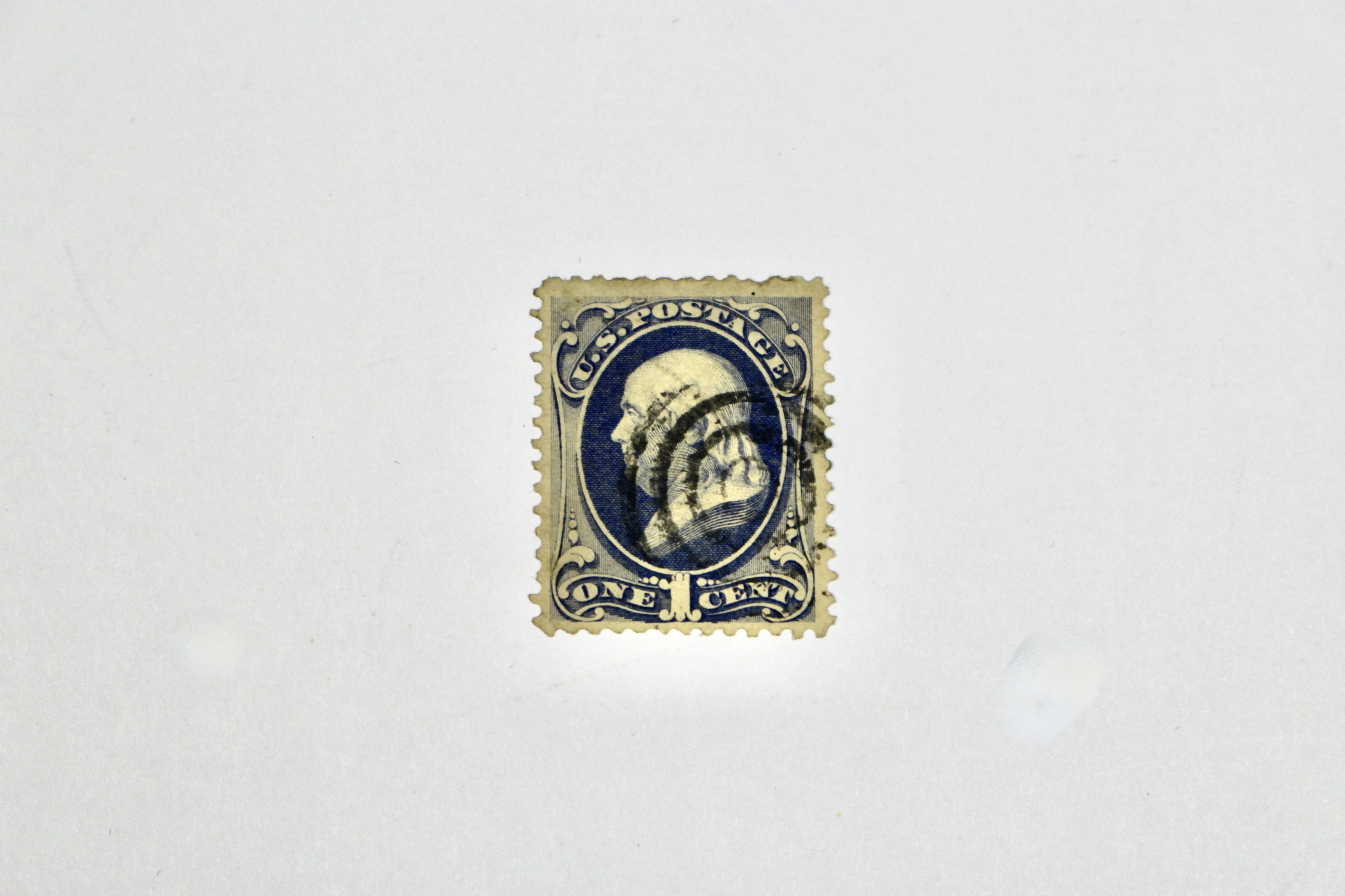 Seven Early U.S. Postage Stamps, All with Grills