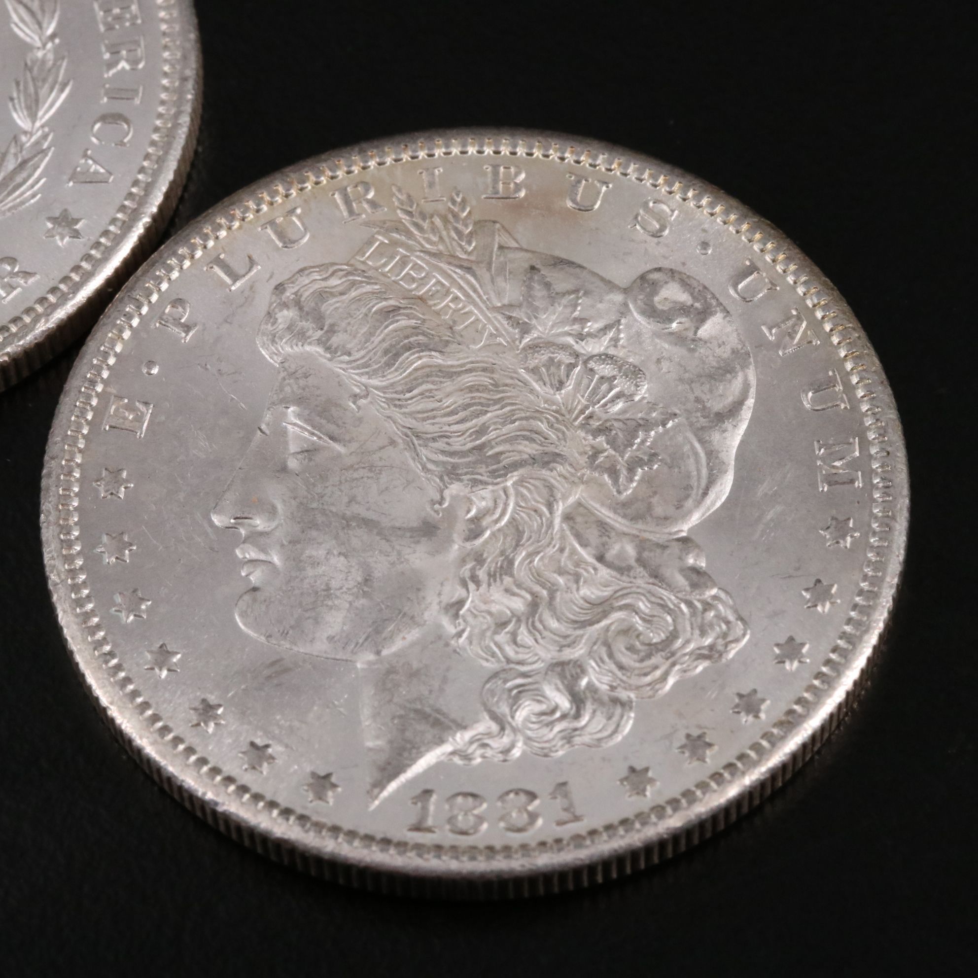 Two 1881-S Morgan Silver Dollars