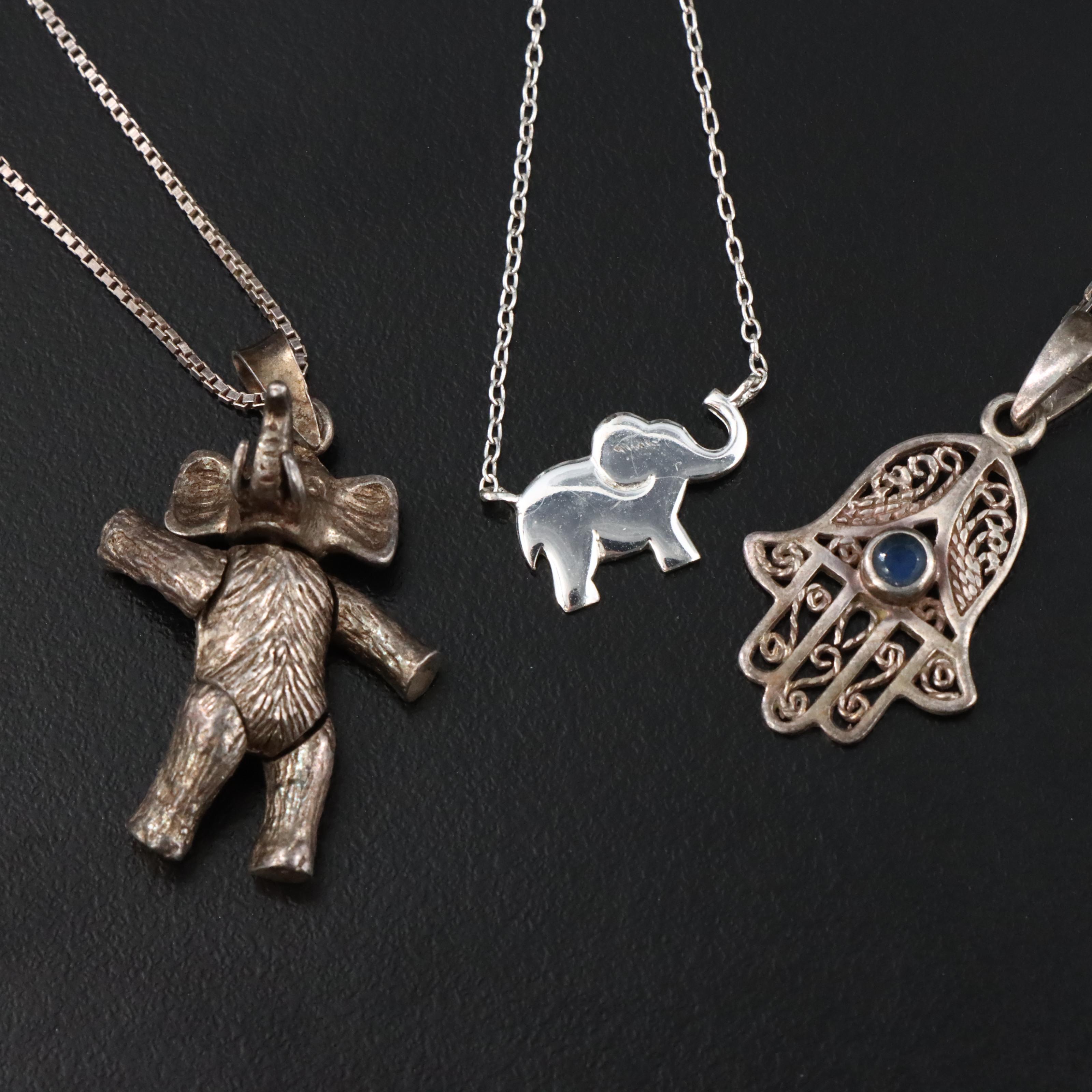 Sterling Necklaces Including Articulated Elephant and Glass Hamsa
