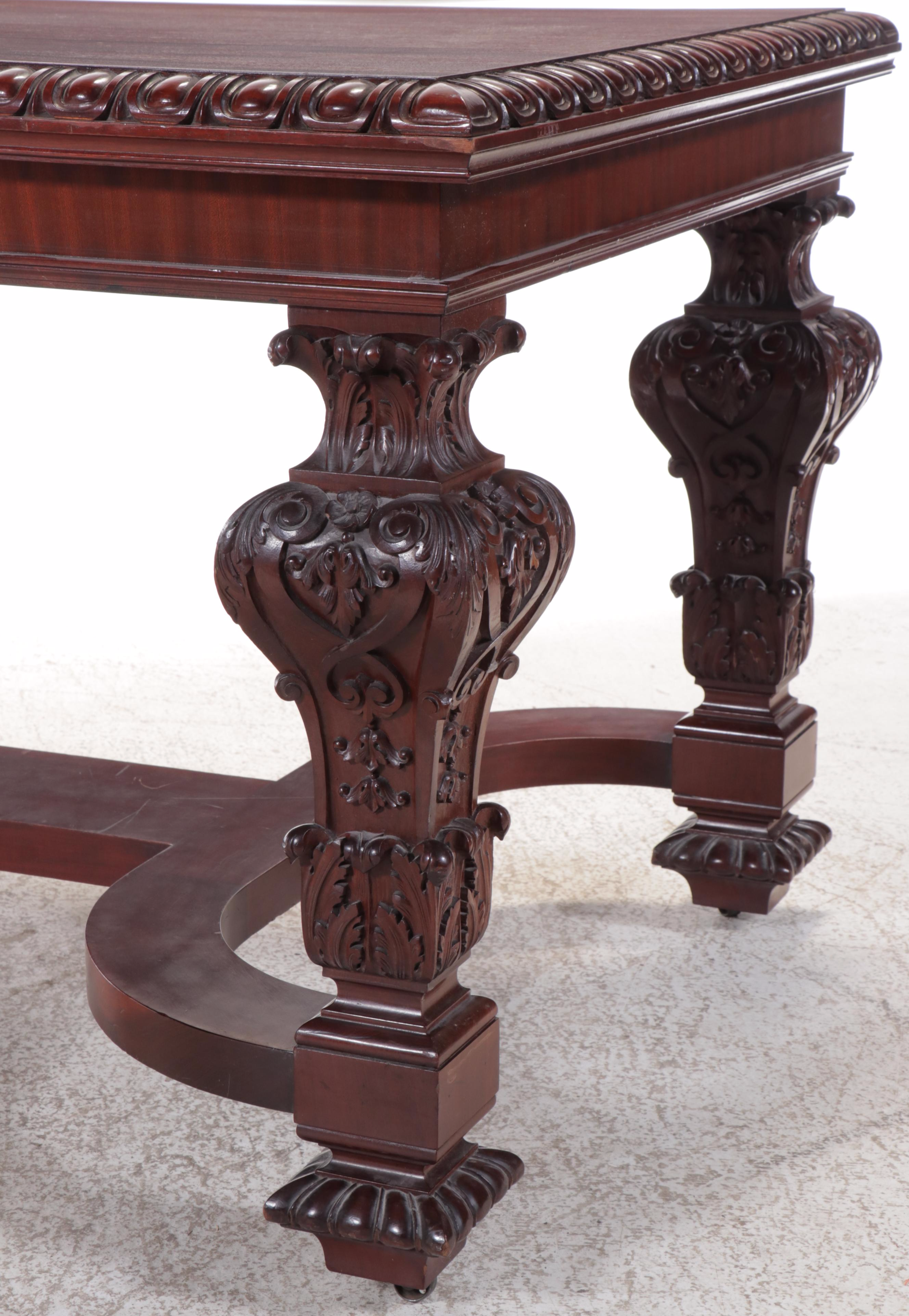 Jacobean Style Carved Mahogany Library Table on Casters, 20th Century